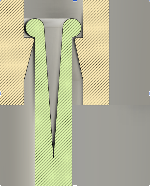 A top-down view of a green and beige airplane on a gray tarmac with surrounding beige sections.