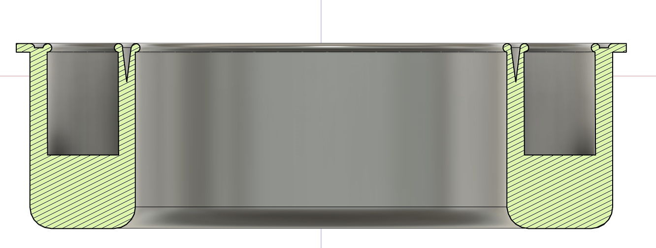 Cross-sectional diagram of a metal container with two separate compartments, each with a vertical partition and a rounded bottom, showing the interior layout.