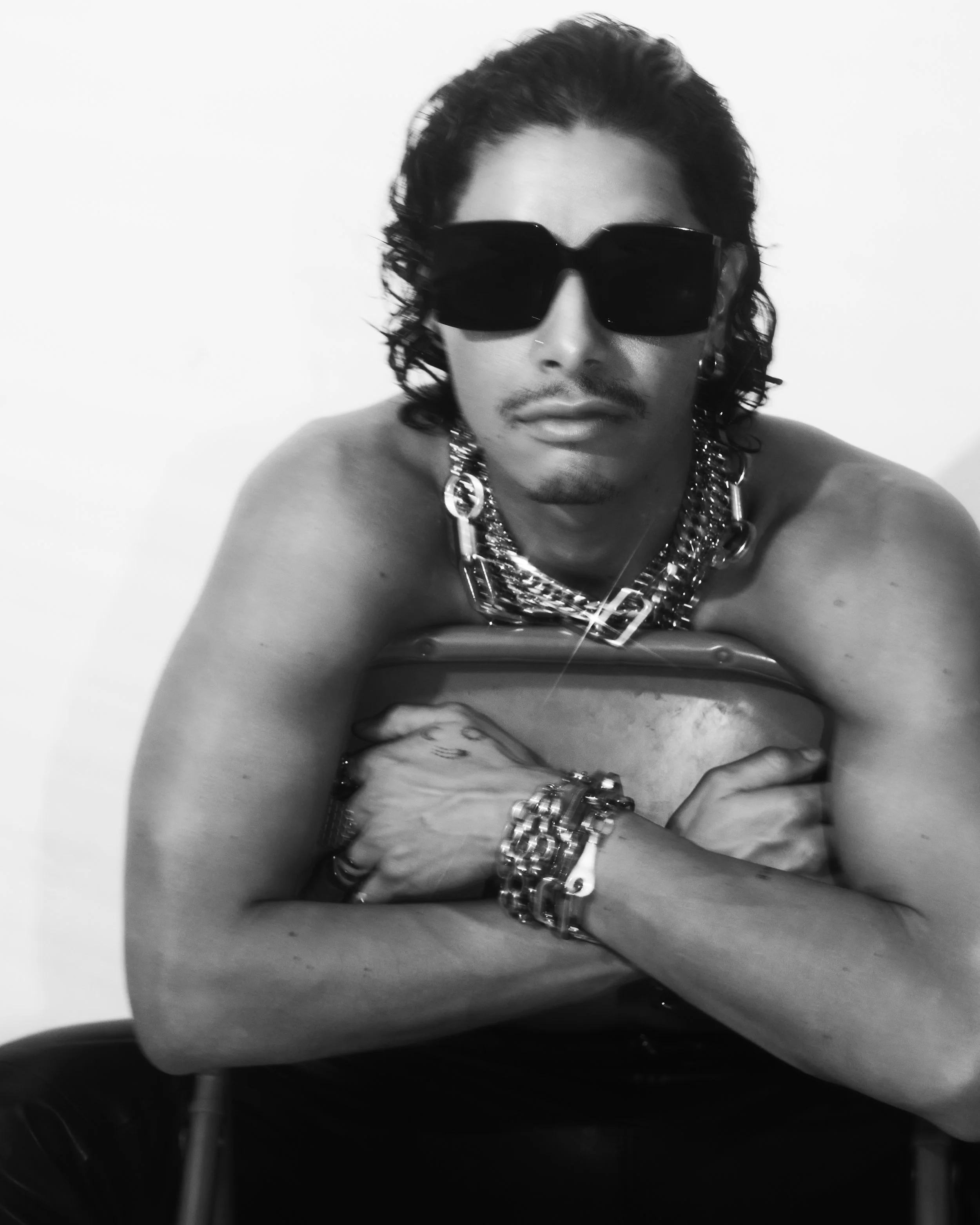A. Chal.
Photographer: Hunter Arthur.
Stylist: Natalie Reynoso, Samira Frias.
Jewelry: Laruicci.
Shades: Celine.
Sweater: Laruicci.
Leather Jacket and Pants:  Press esc. @press_______esc
