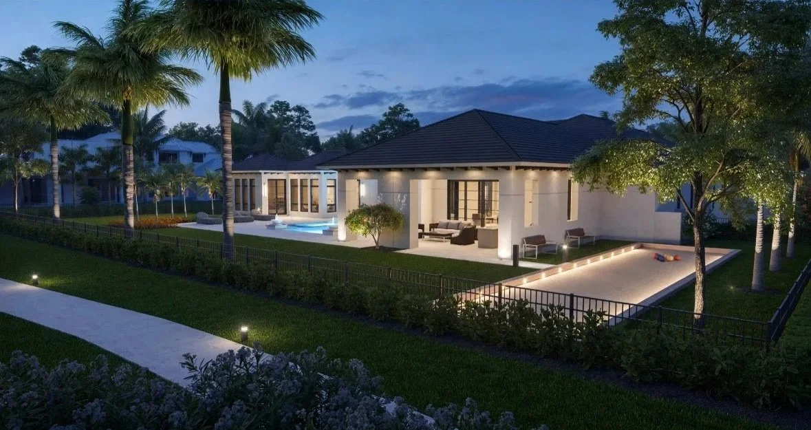 A modern house with outdoor lighting, surrounded by trees and a well-maintained lawn, featuring a pool and a sandpit area.