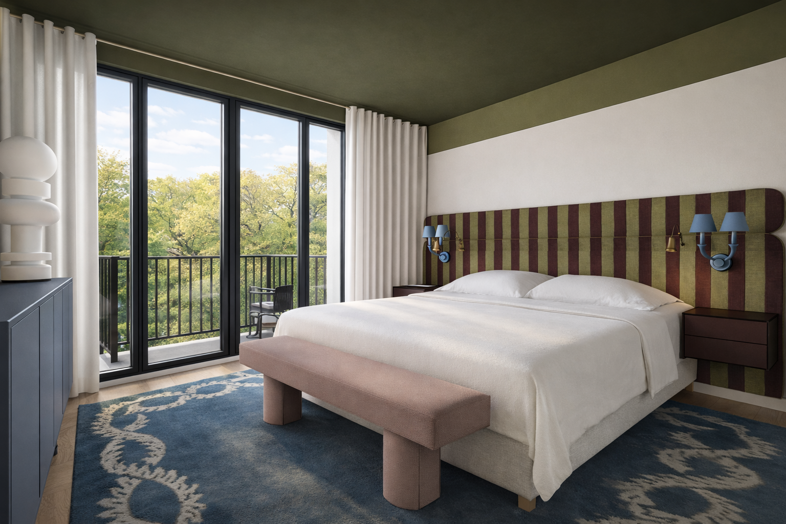 Hotel room with a large bed, striped headboard, blue wall-mounted lamps, and a balcony with outdoor seating.