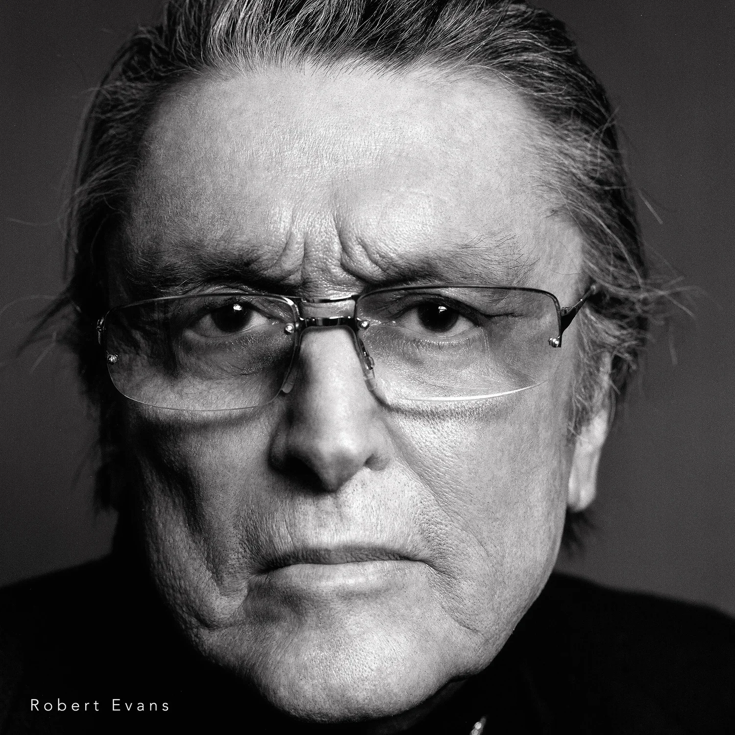 Legendary film producer Robert Evans dramatic black and white studio portrait photographed by Ken Sax in Los Angeles.