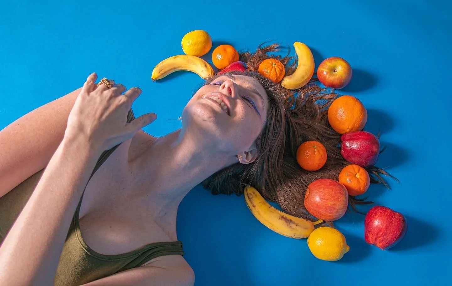 Pretending to shoot for a shampoo product brand (the fruits were representing the tropical smell of the shampoo) 