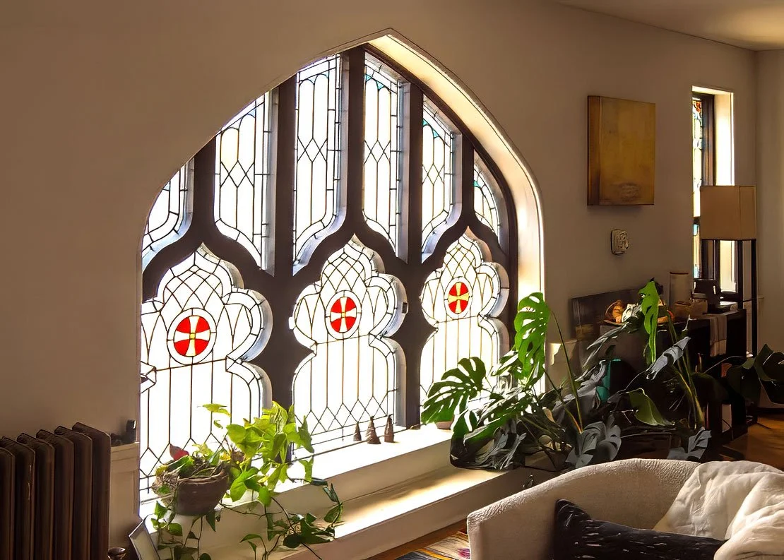 Sunlit therapist's office with a large Gothic stained-glass window and potted tropical plants,.