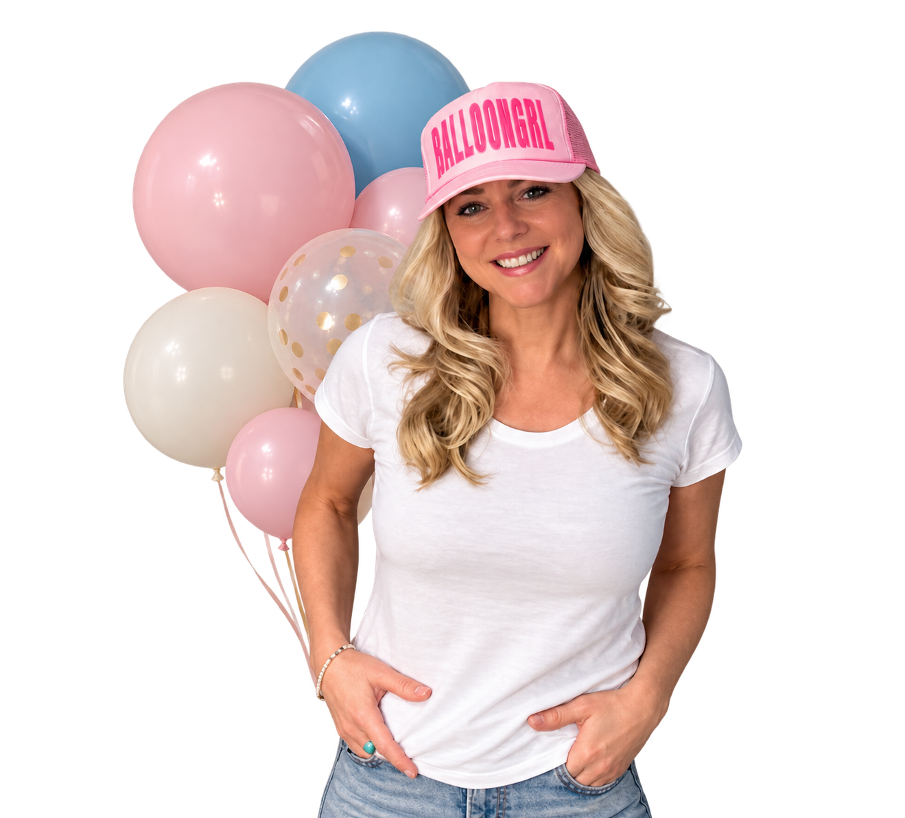 Woman smiling in front of pink, white, blue, and pastel balloons, wearing a pink cap that says 'Balloon Girl' and a white t-shirt.
