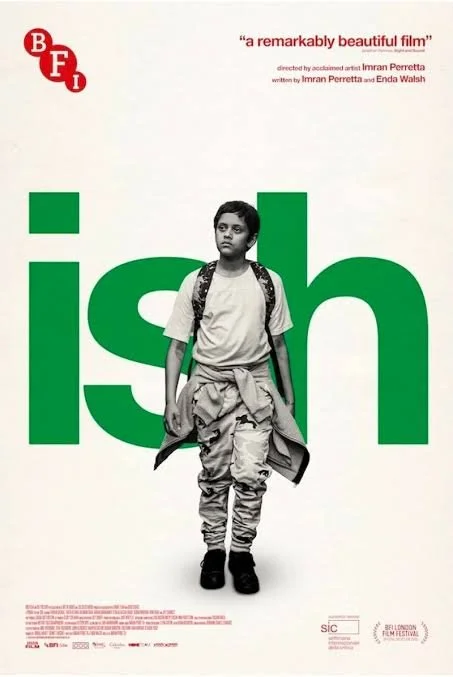 Poster for the film 'Isheh' featuring a young boy with a backpack, standing with a serious expression against a white background with large green text reading 'ish'.