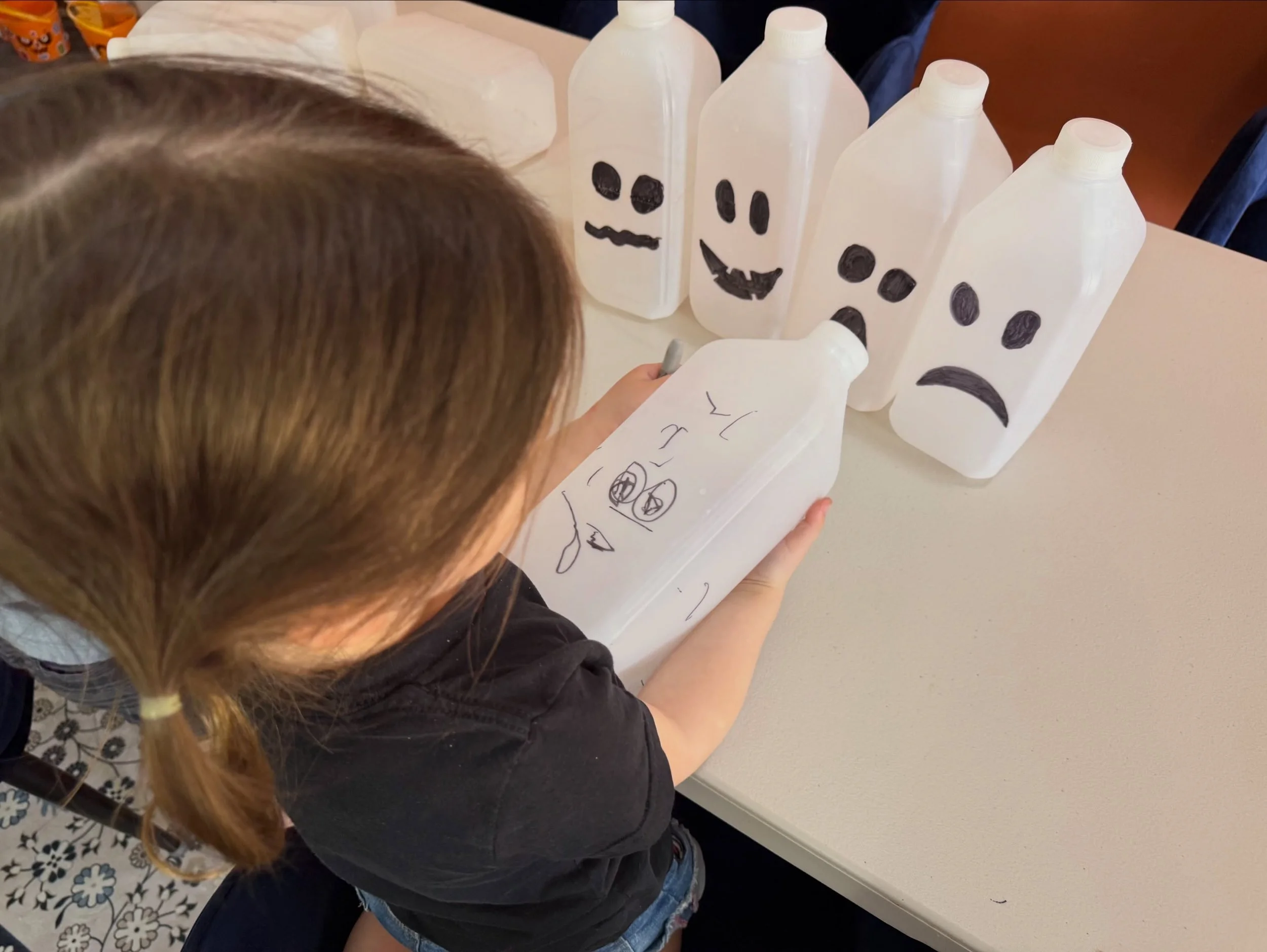 🎃 COAST KIDS ASKS: LOW-COST HALLOWEEN IDEAS

We&rsquo;ve been saving empty milk bottles, and the kids turned them into a little ghost family 👻

All it took was a black permanent marker and a battery-powered tealight inside each bottle. Easy enough 