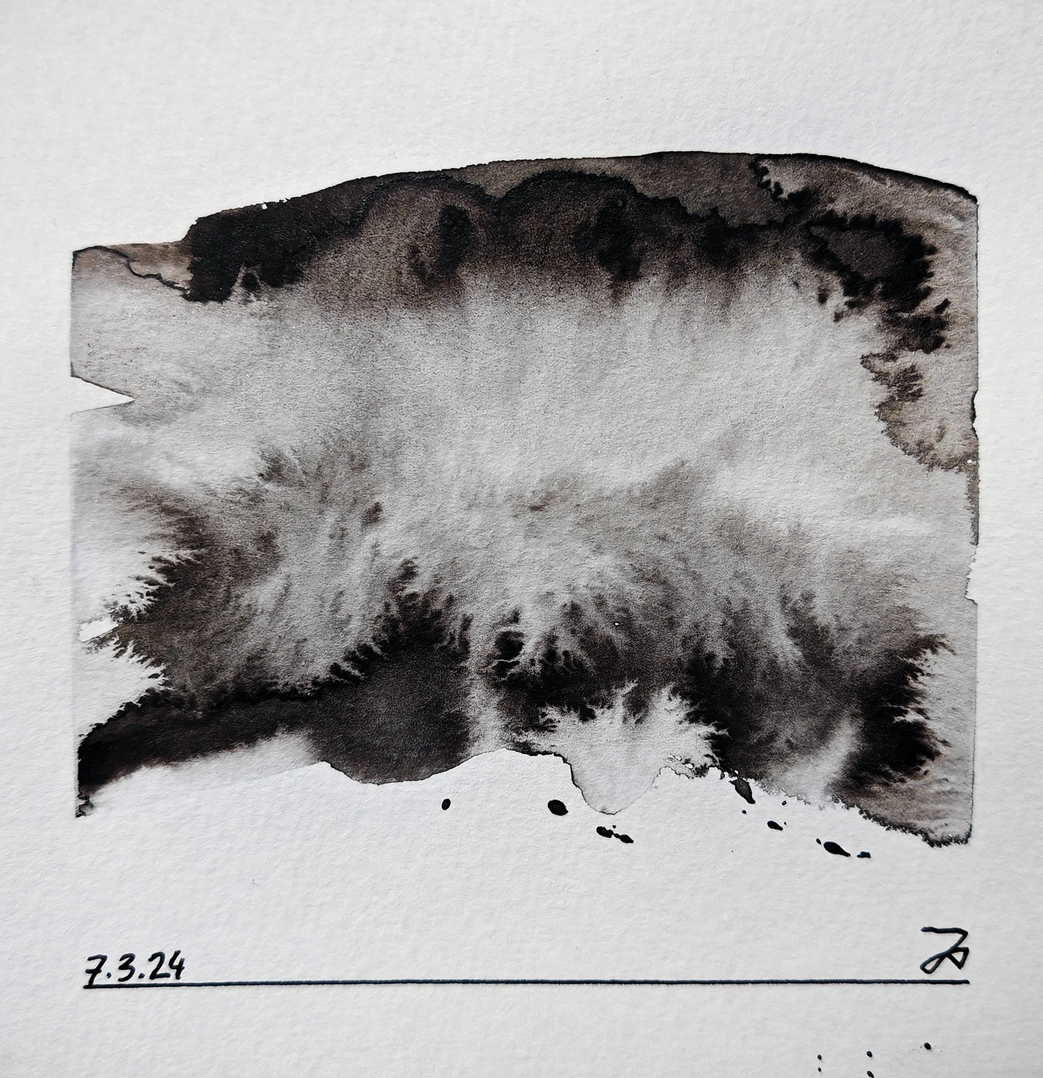 Black inkblot on white paper with handwritten date 7.3.24 at the bottom left corner.