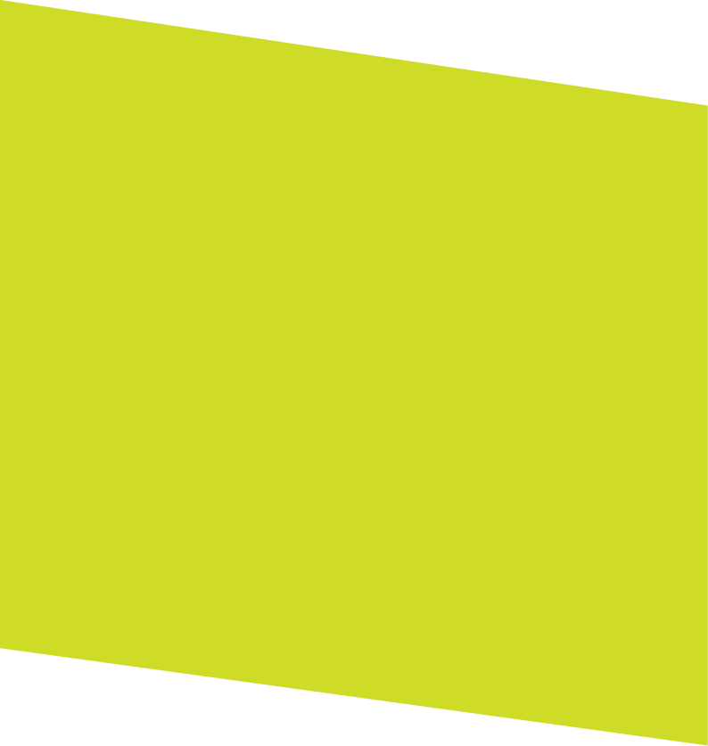 A bright yellow-green wall with a diagonal white ceiling in the background.