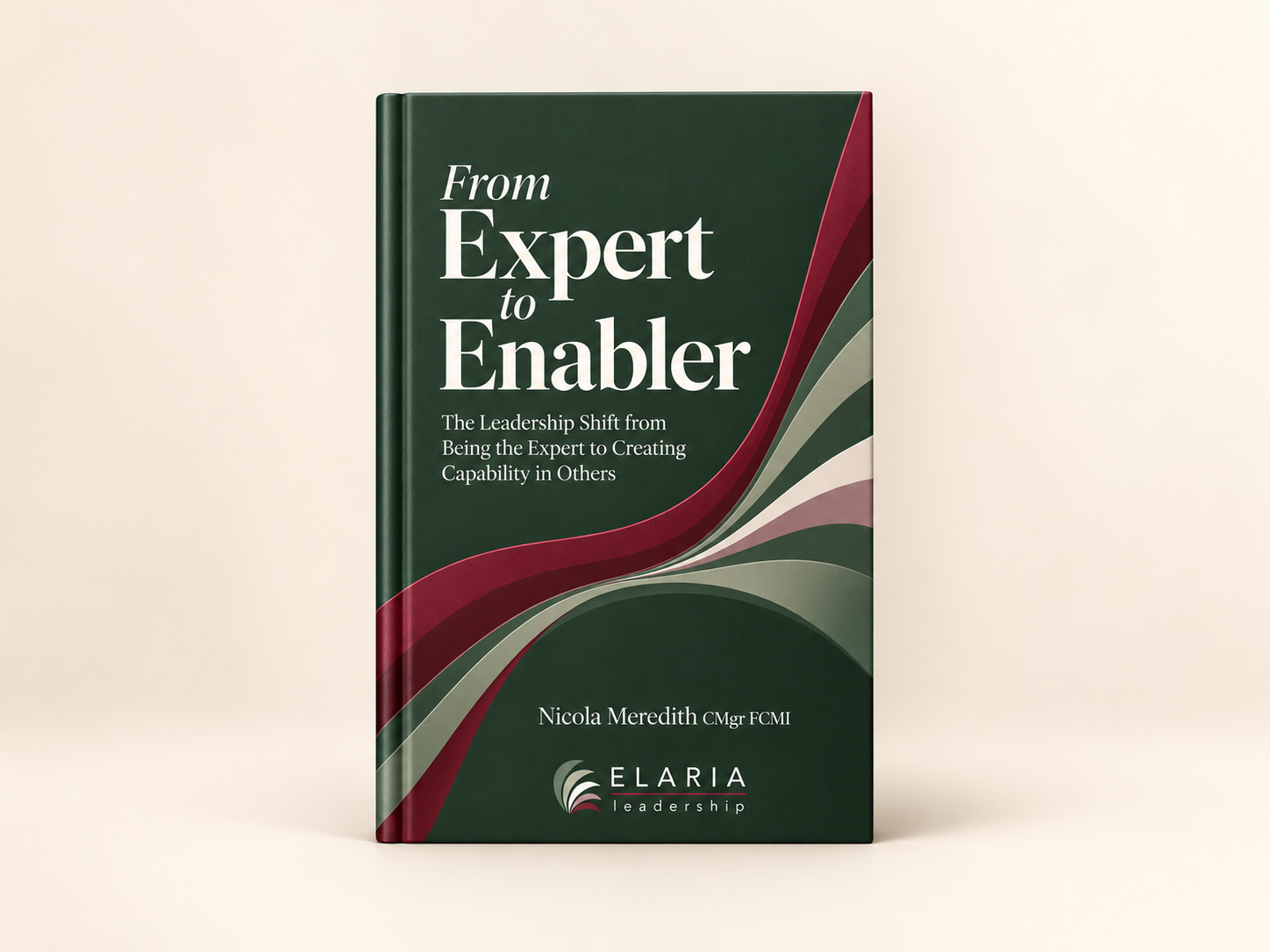 A hardcover book titled 'From Expert to Enabler' by Nicola Meredith features a dark green background with curved red, beige, and gray lines and includes the subtitle 'The Leadership Shift from Being the Expert to Creating Capability in Others.' The ELARIA leadership logo