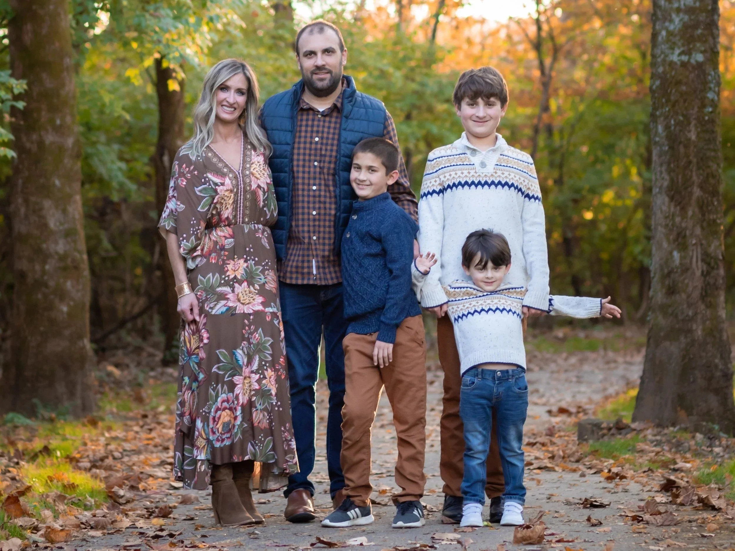 Family of five on a wooded trail at Aspen Grove Park in Franklin, TN