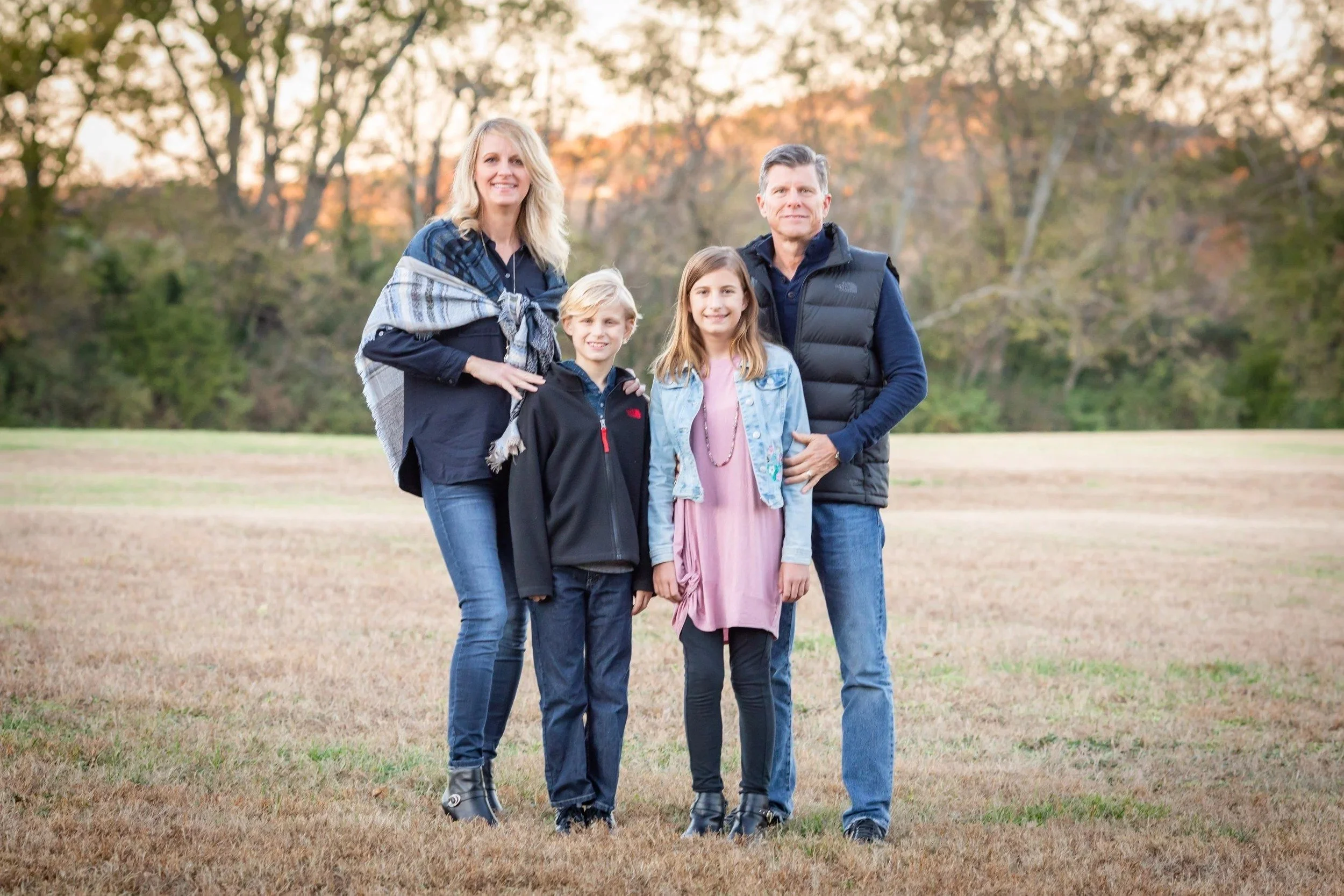 Family of four in an open field at Smith Park in Brentwood, TN
