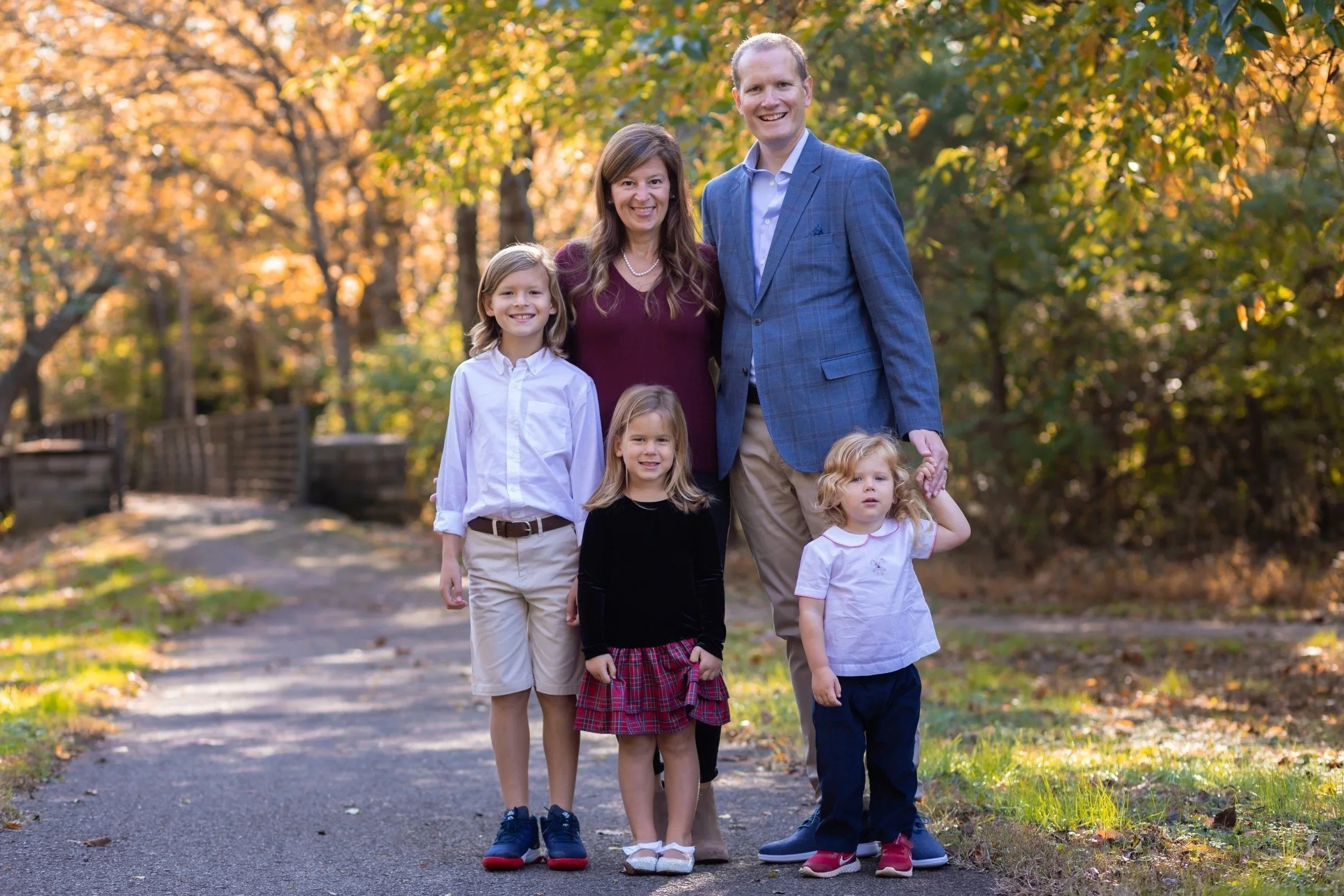 Family of five on a gravel path at Aspen Grove Park in Franklin, TN