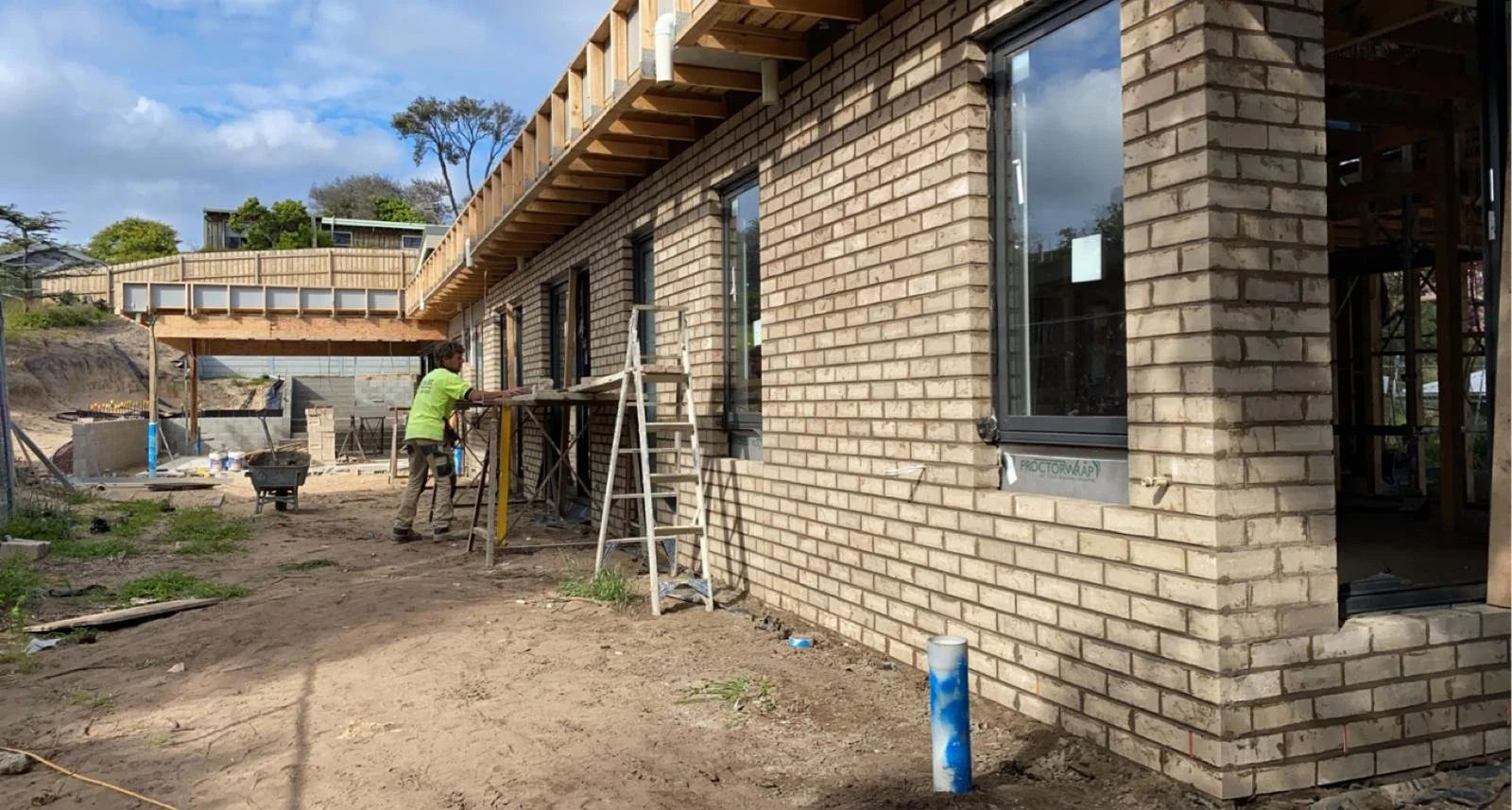 Light face brickwork going up on a new home under scaffold.