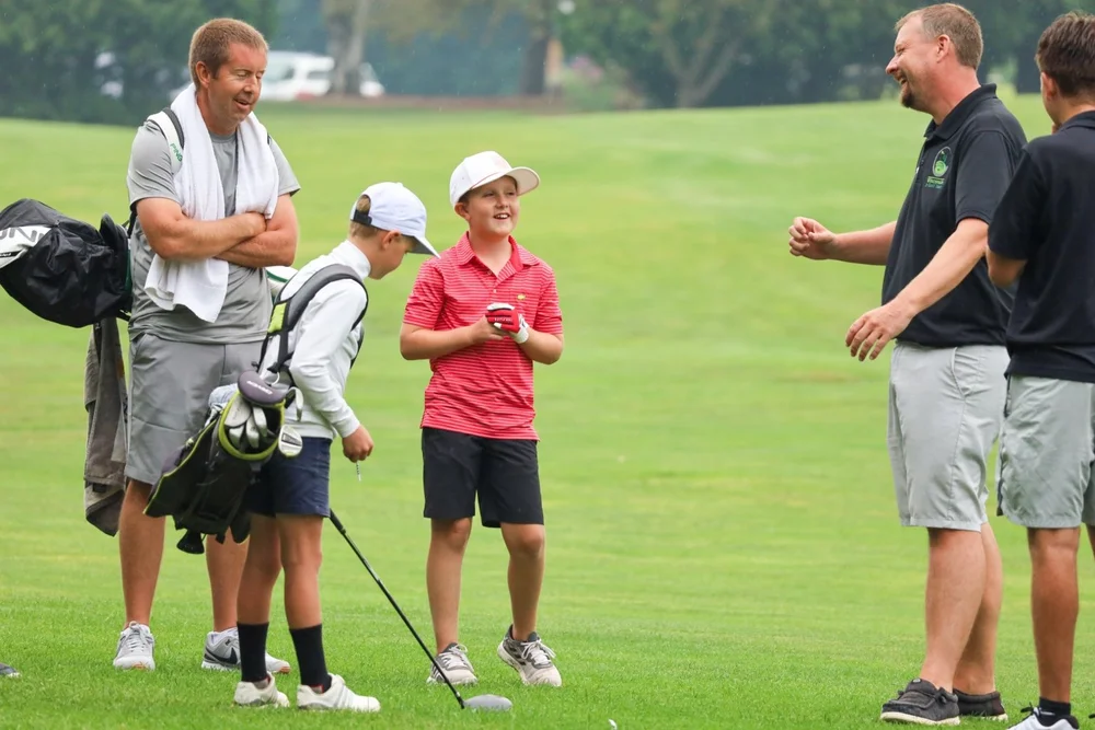 Young golfer smiling during a Legends League event.