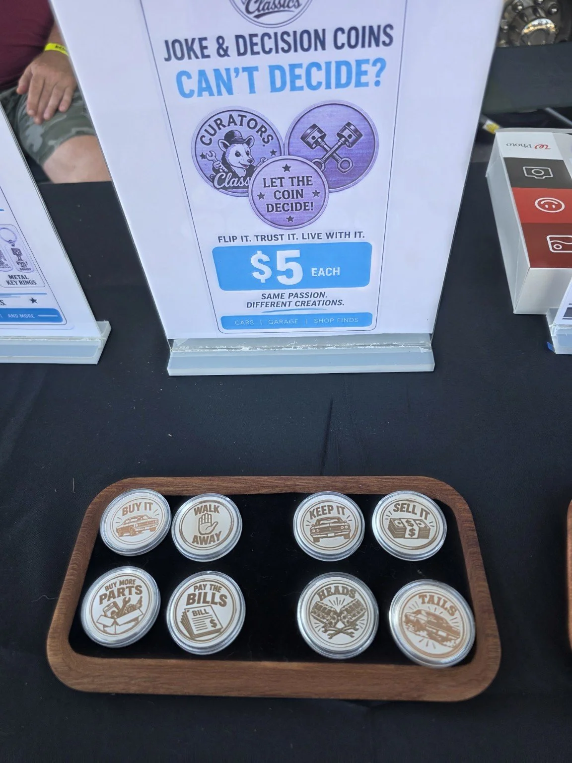 Joke and decision coins on display at the swap meet.