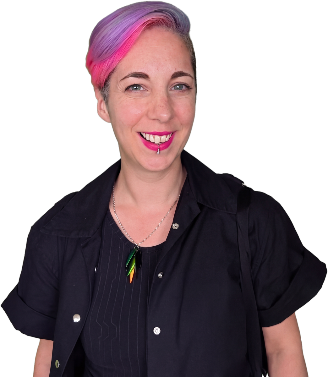 It's Mo! A person with short, colorful hair, wearing a black shirt and rainbow-colored necklace, smiling at the camera.