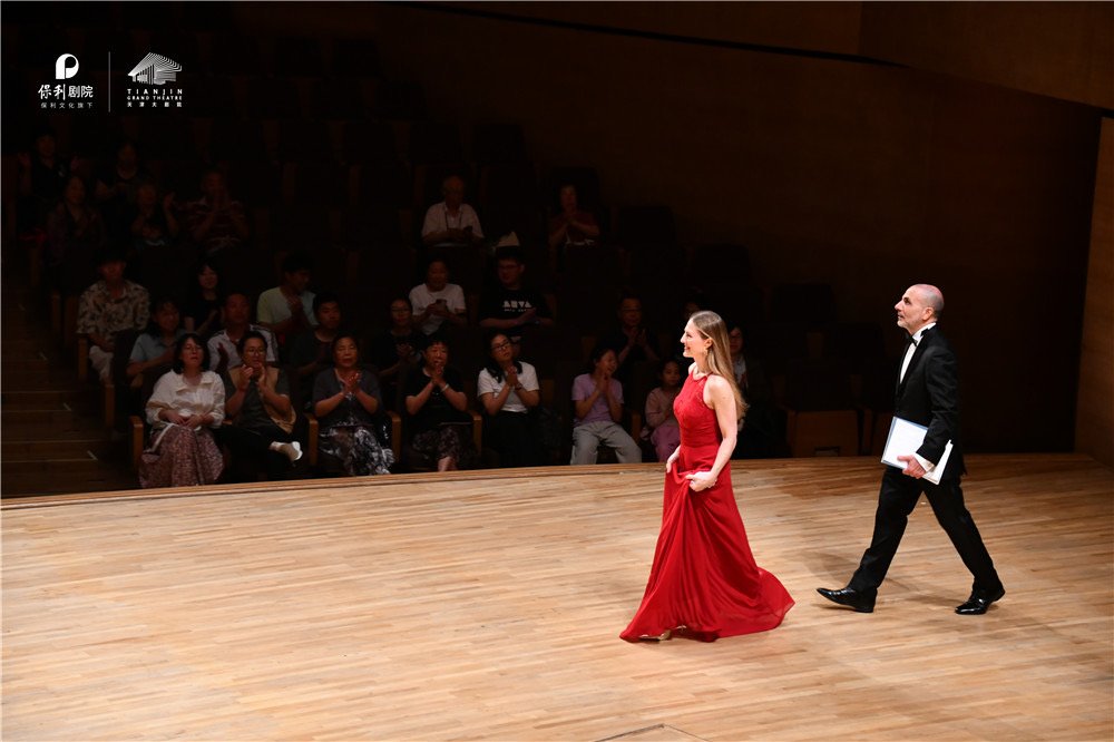 Costa & Casanova Piano Duo acknowledging the audience after a concert performance.