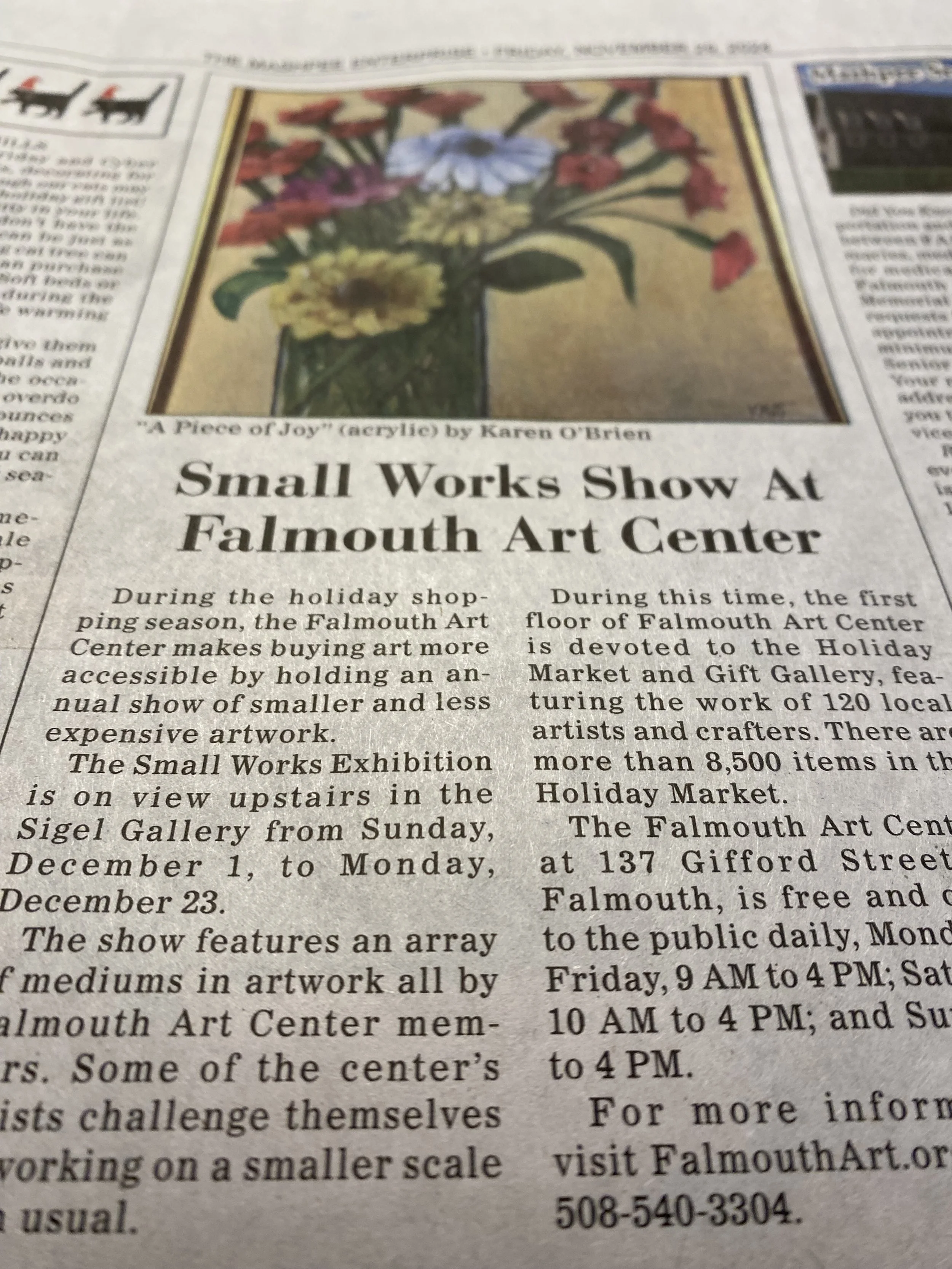 Newspaper article with a photo of a colorful floral painting titled 'A Piece of Joy' by Karen O'Brien, promoting an art exhibit at the Falmouth Art Center.