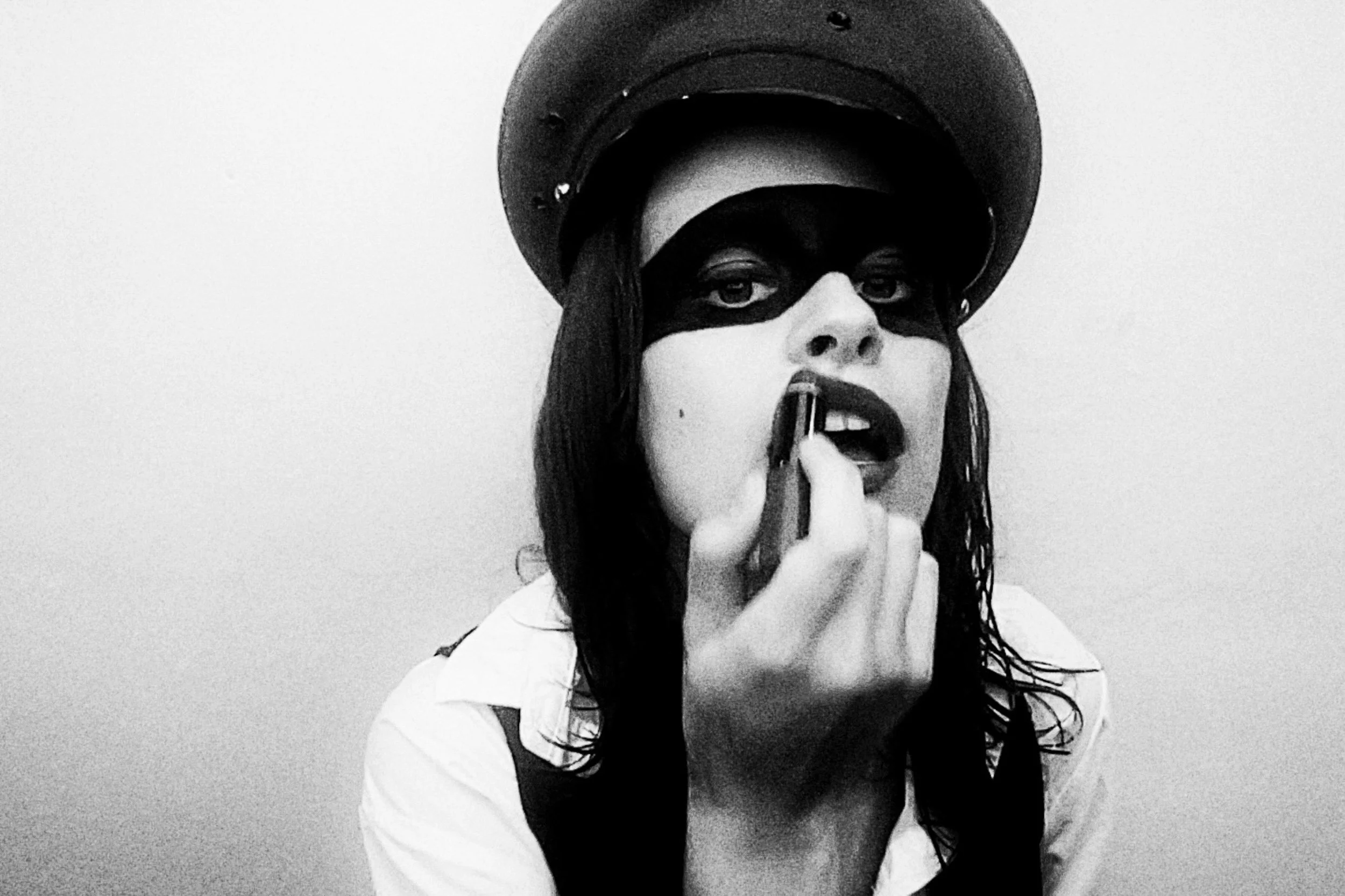 Black-and-white close-up portrait wearing a hat and makeup. KAMILLA ANDREA POLESE