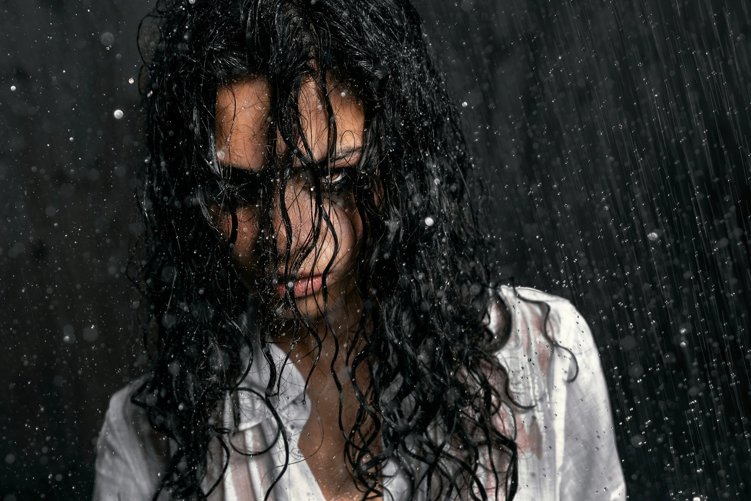 Close-up fashion portrait with wet hair and dramatic lighting. IZABELLA VILARCHAO