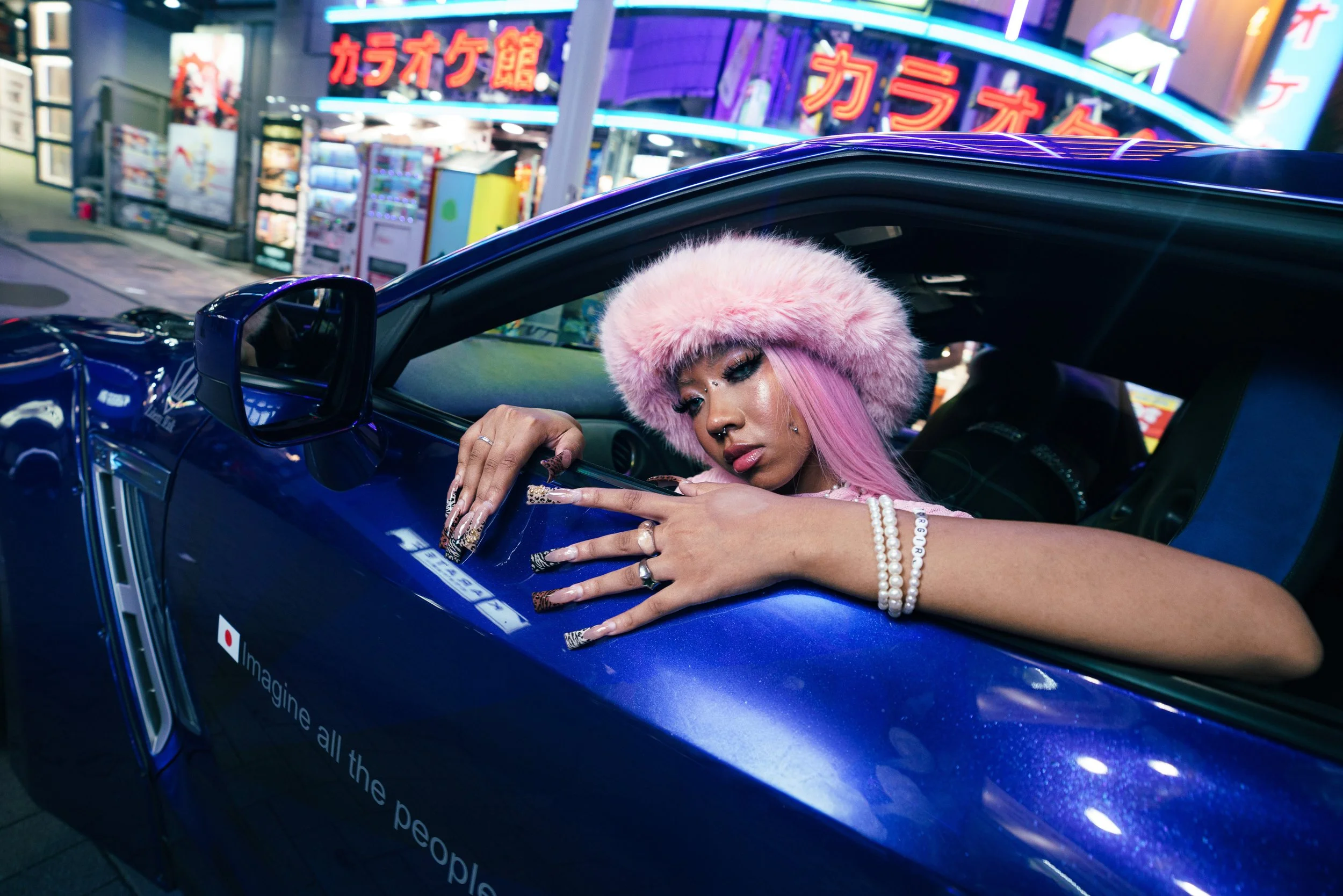 Colorful fashion portrait wearing a pink hat in a vibrant interior. 3LI¥EN