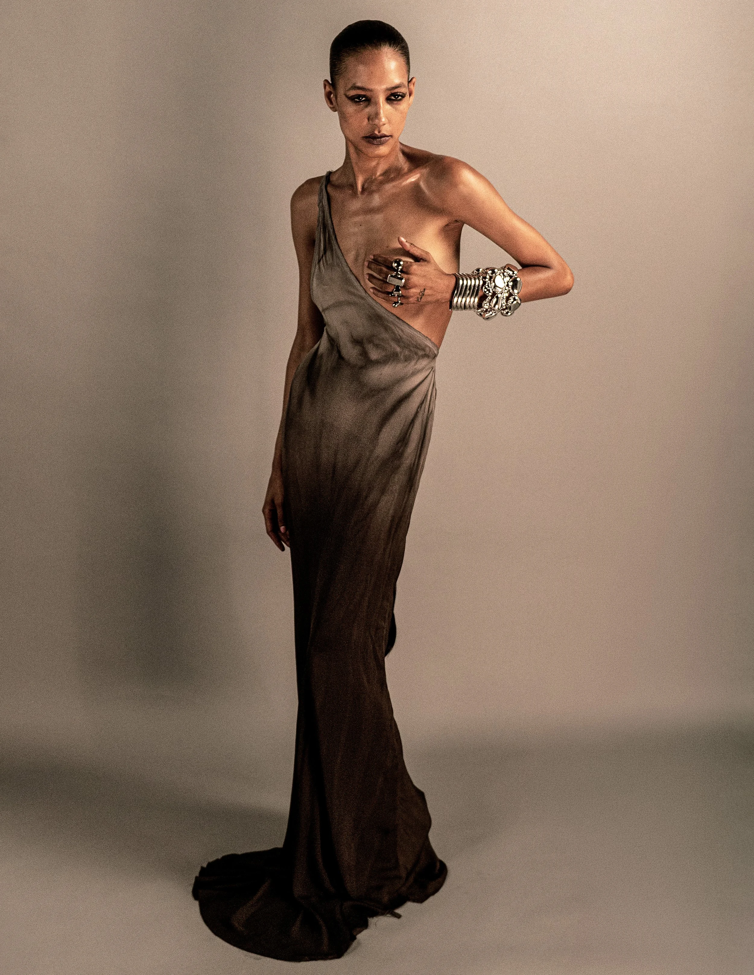 Full-length studio fashion portrait in a neutral-toned outfit. MARIAJOSE MARTE