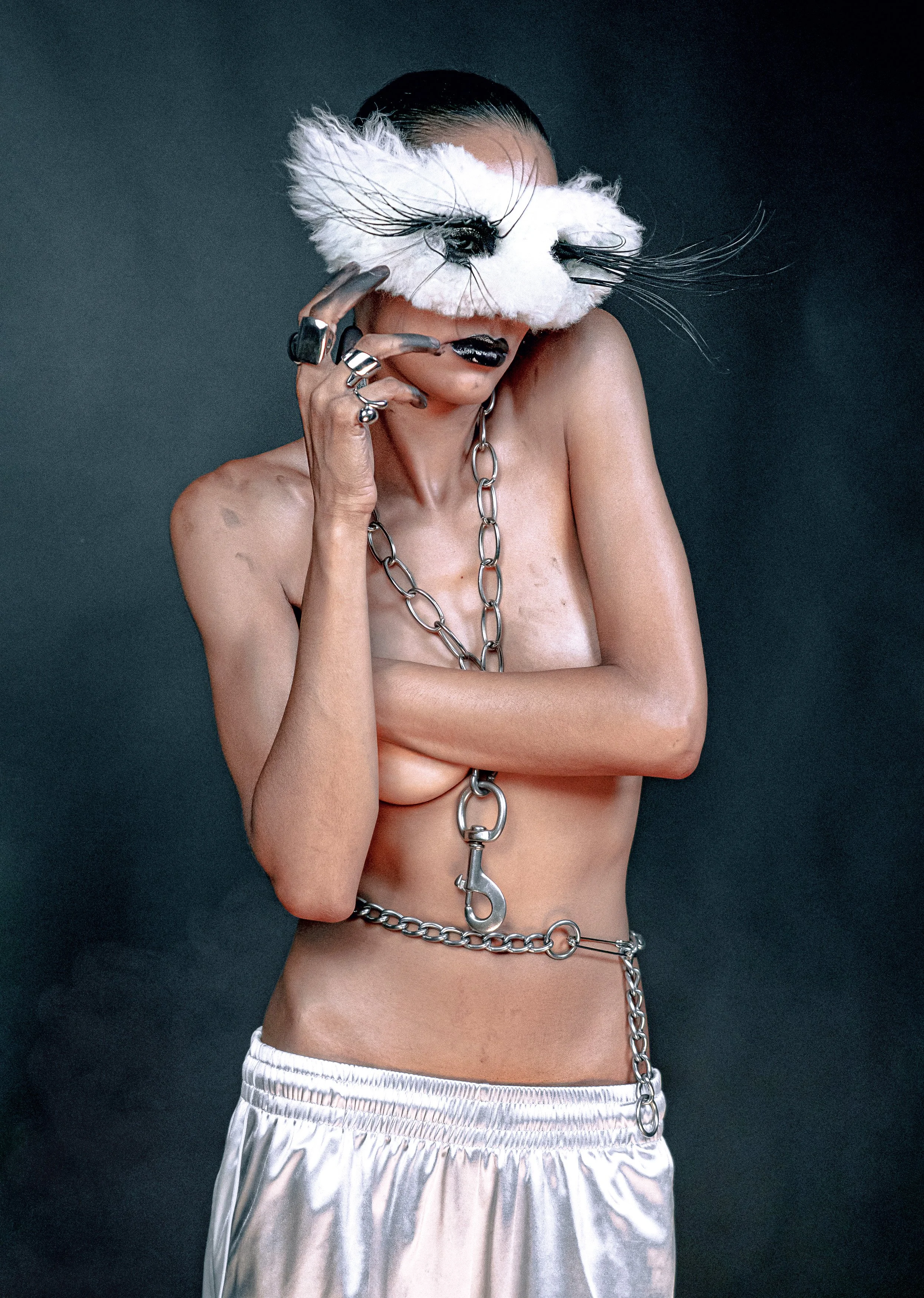 Fashion detail portrait with layered jewelry and hands across the chest. MARIAJOSE MARTE