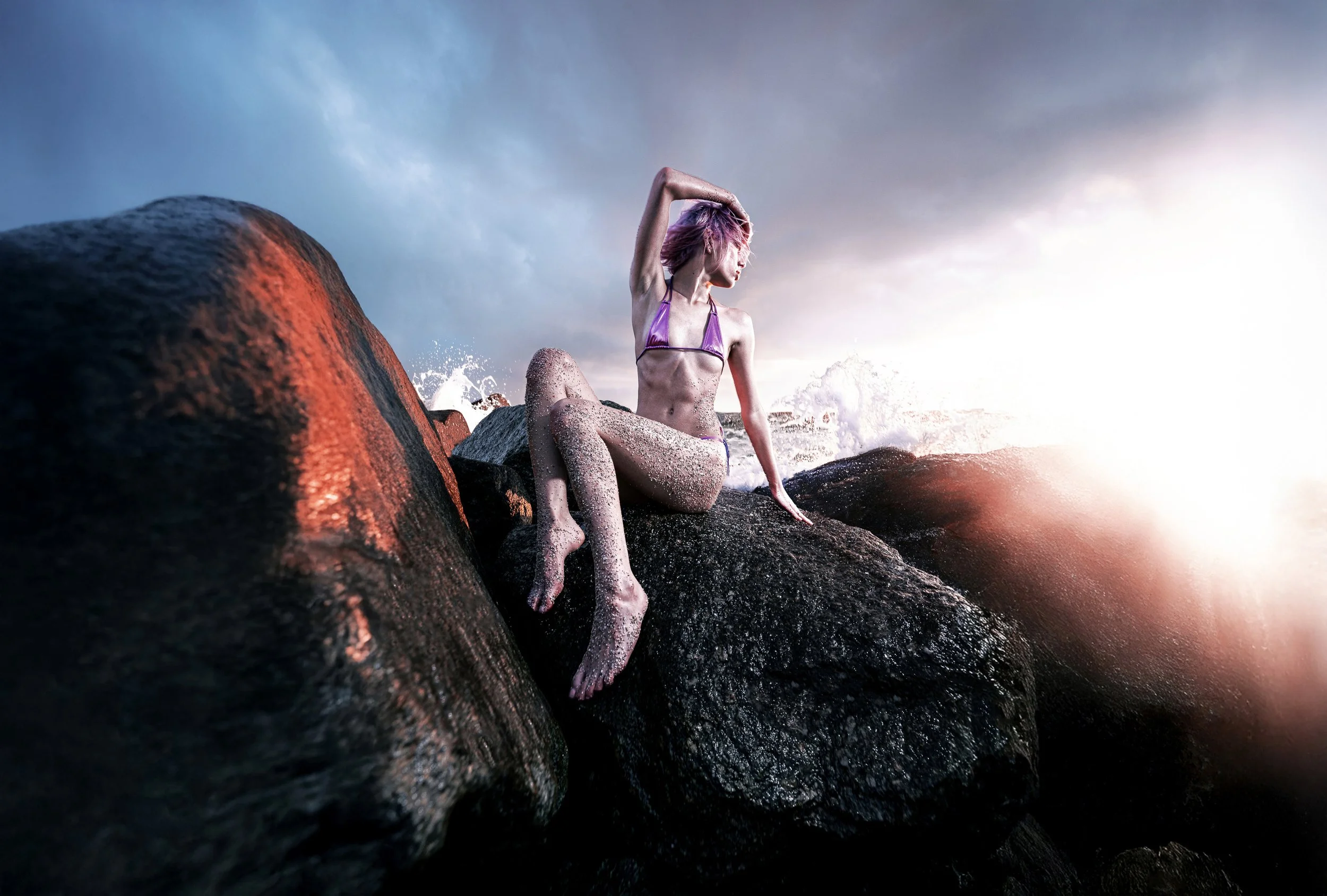 Fashion portrait photographed outdoors across a dramatic rocky landscape. PARIS OSONA