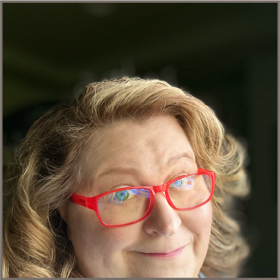 Jennifer Vivekanand, author, pink glasses