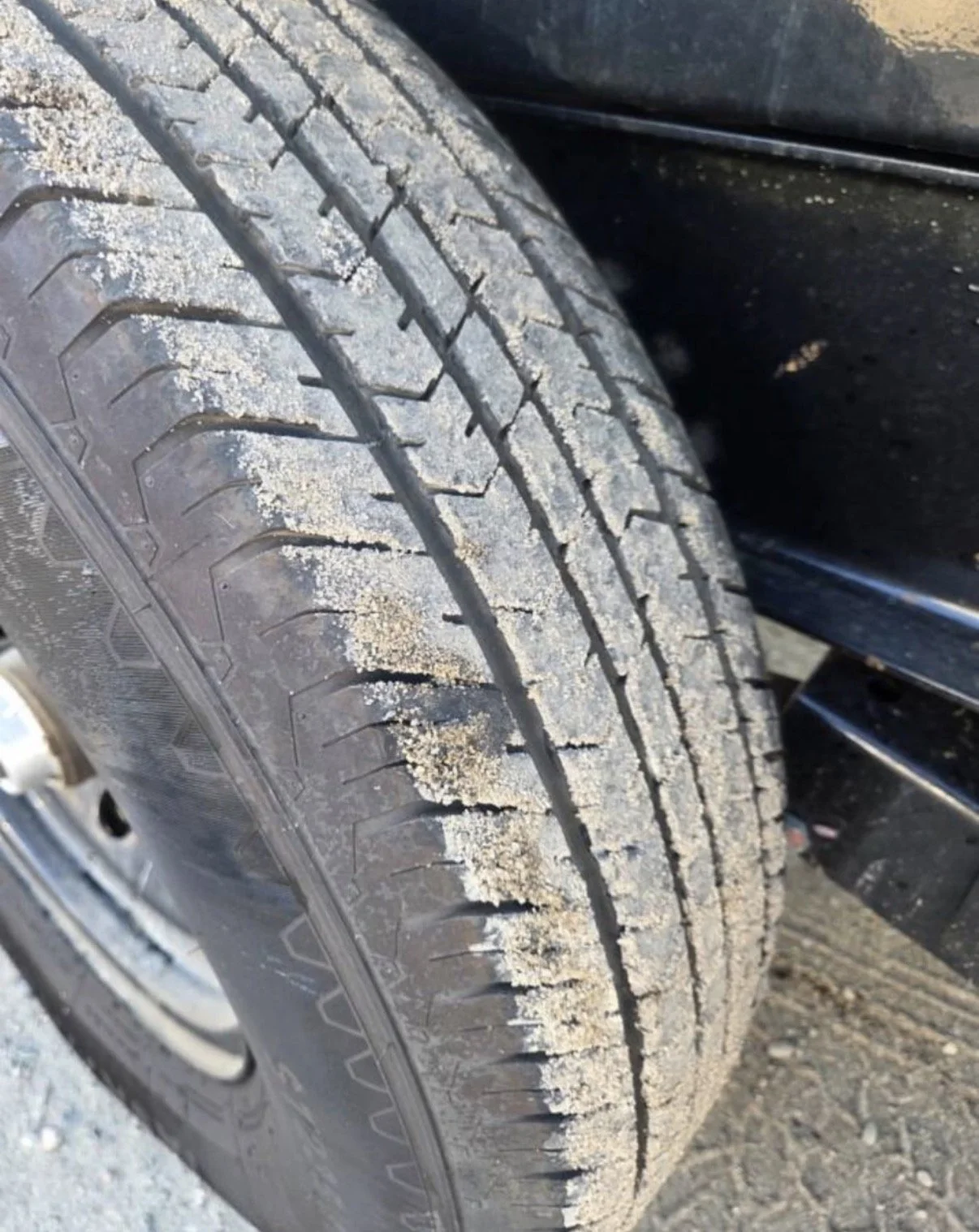 2026 ED dump trailer, detailed close-up of trailer tire tread and condition.