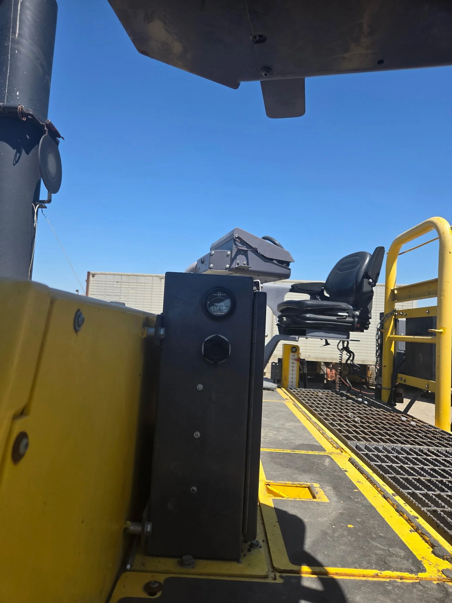 2017 Dynapac F1000T asphalt paver, side view showing operator platform and handrails.