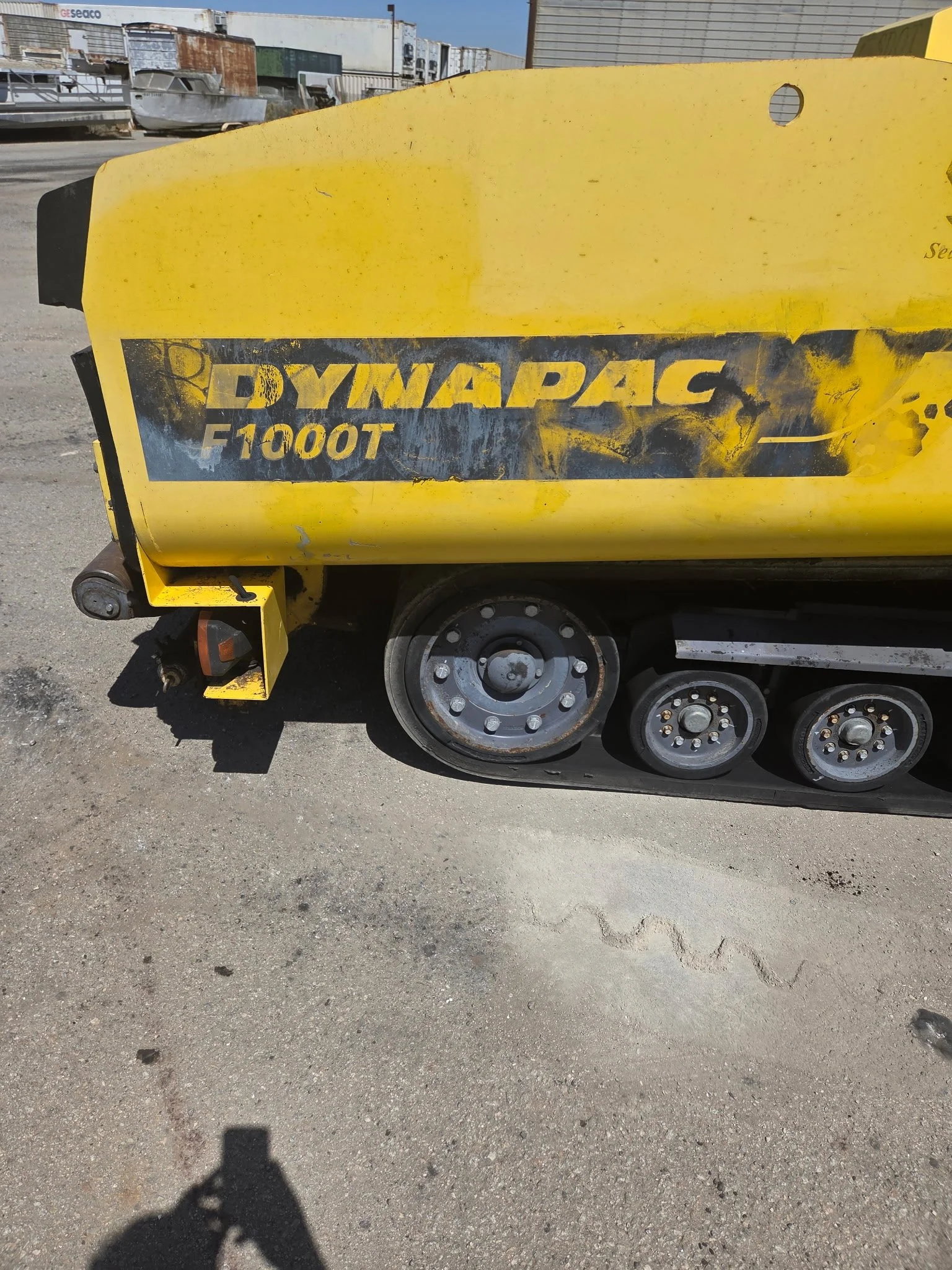 2017 Dynapac F1000T asphalt paver, side panel showing Dynapac branding.