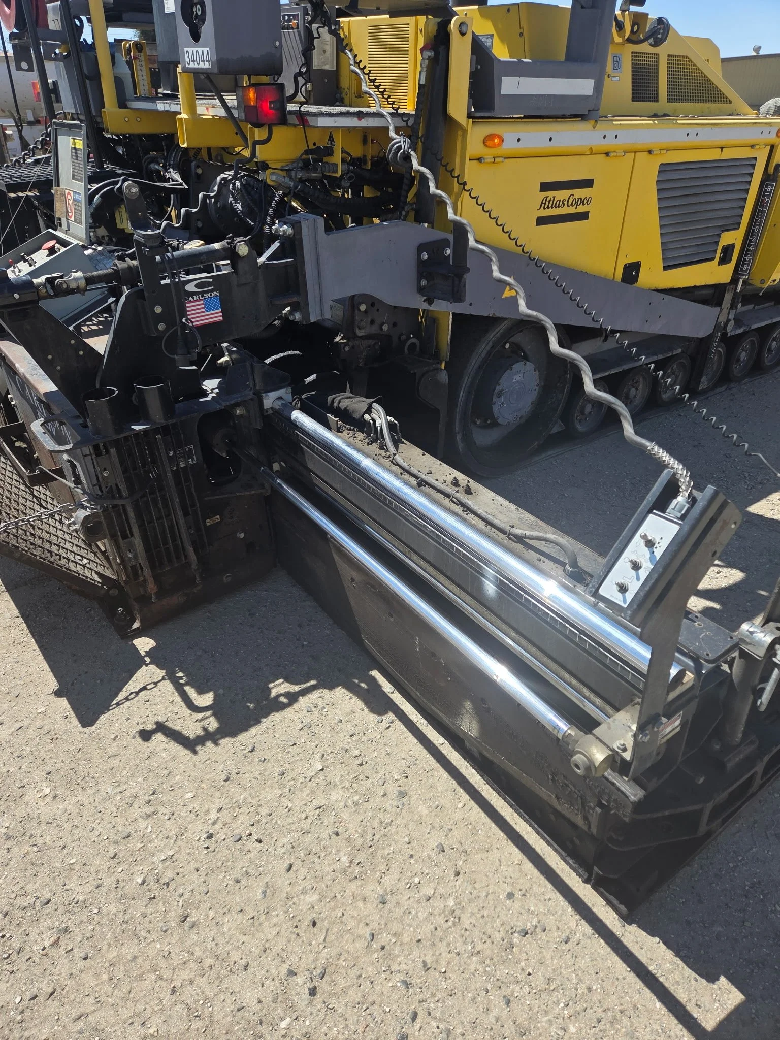 2017 Dynapac F1000T asphalt paver, close-up of rear paving components.