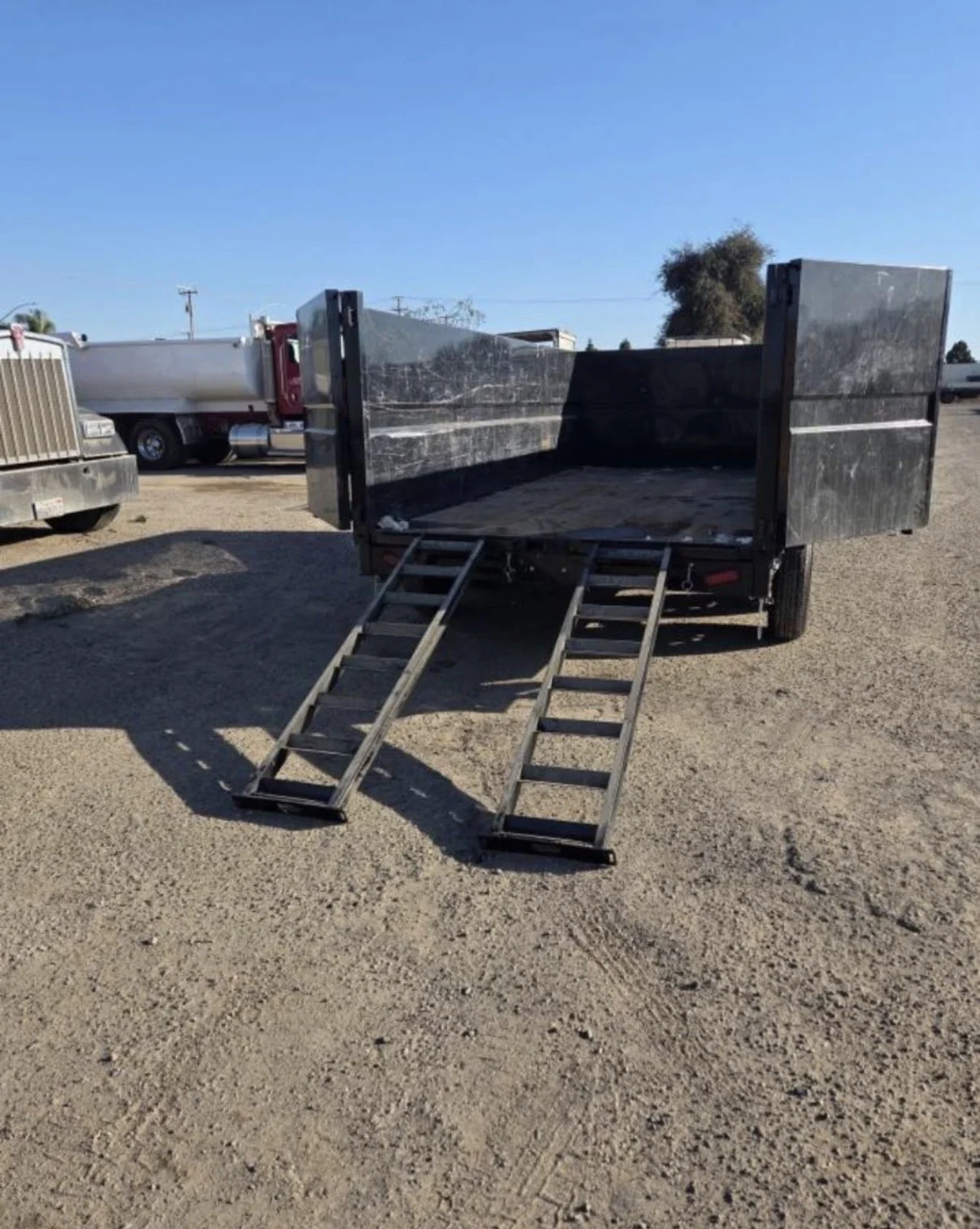 2026 ED dump trailer, rear exterior view. with ramps