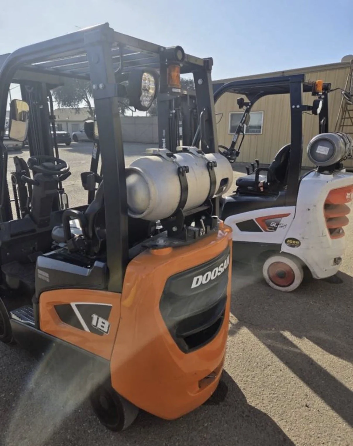 2021 Doosan GC18S-9 forklift, close-up showing steering wheel and operator controls.