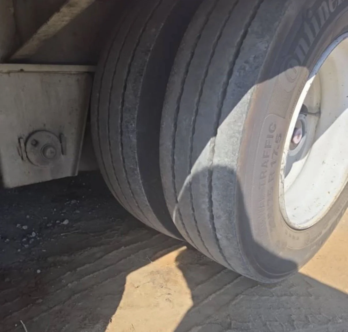 1. 2008 Trail King equipment trailer, close-up showing trailer tires and wheels.
Let's start!