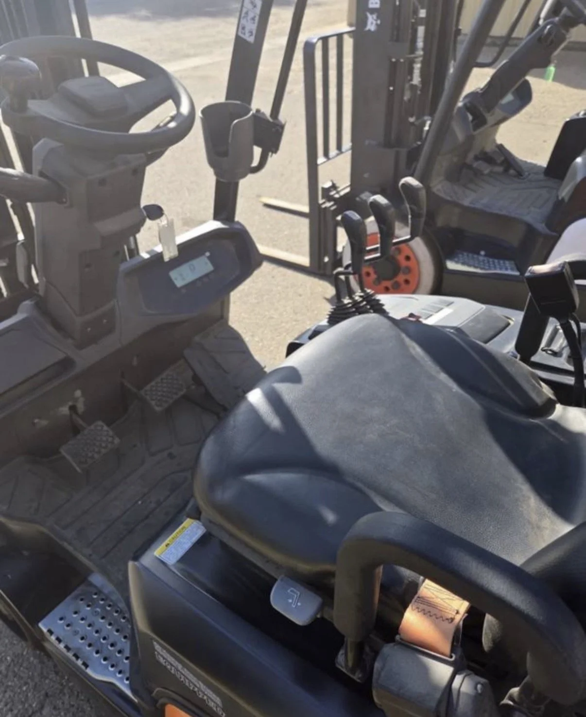 2021 Doosan GC18S-9 forklift, operator compartment showing seat and control levers.
