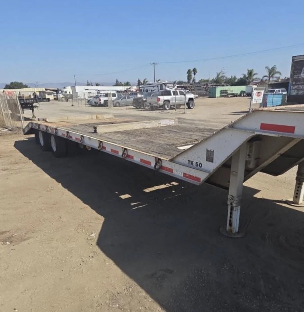 2008 Trail King flatbed trailer, angled view showing deck and trailer frame.
