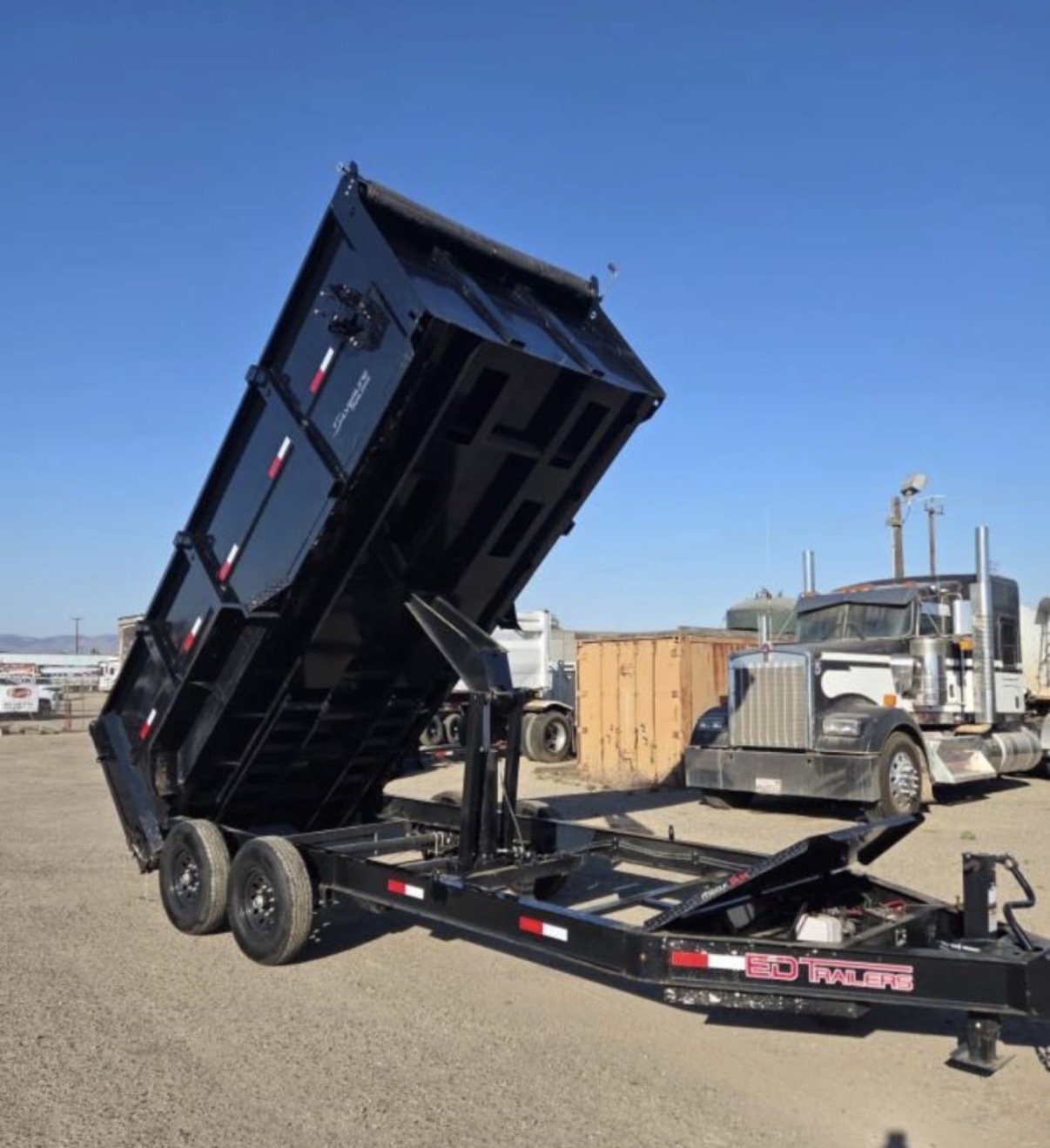 2026 ED dump trailer with hydraulic dump bed raised.