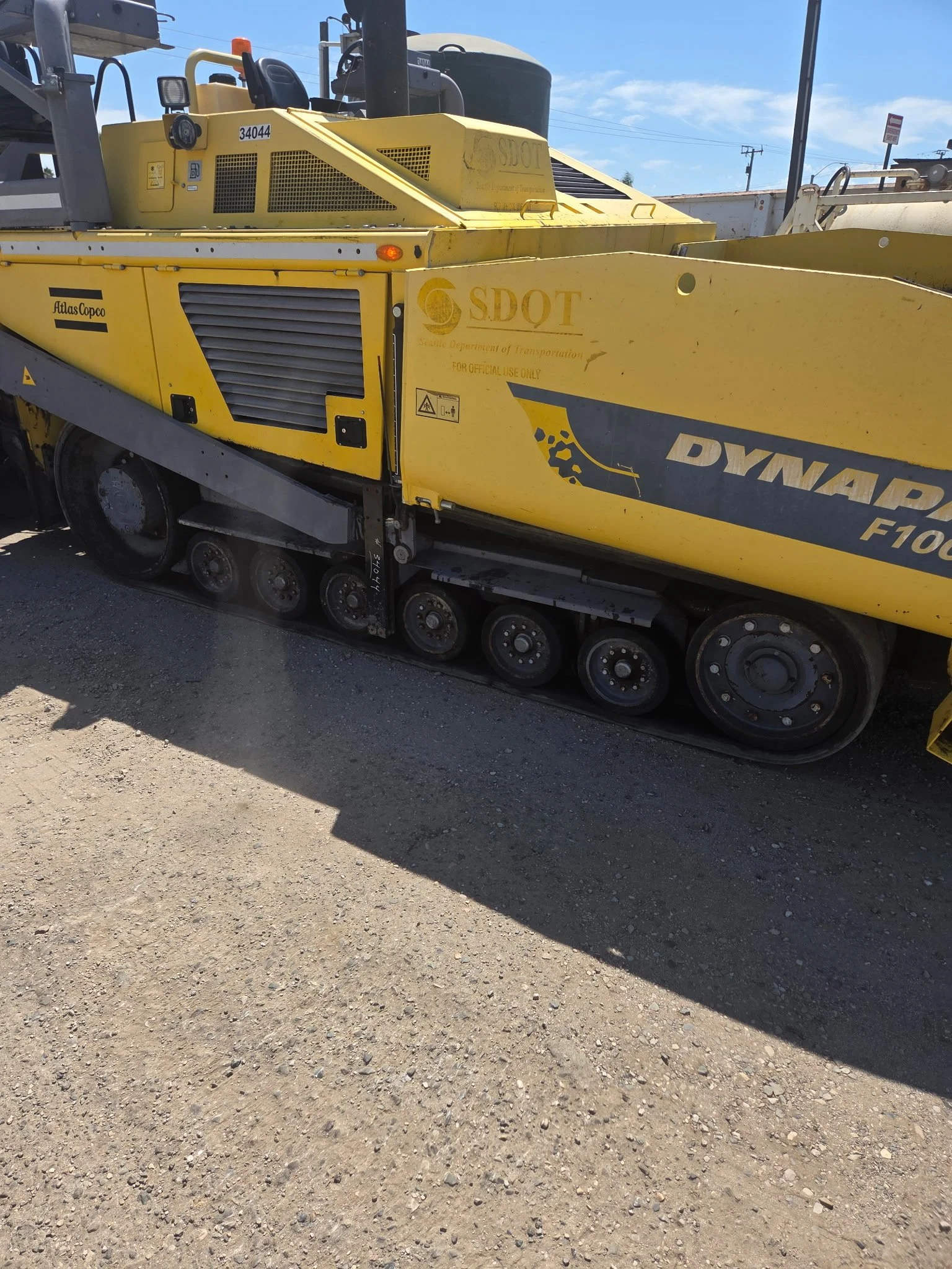 2017 Dynapac F1000T asphalt paver, close-up of yellow exterior body panels.