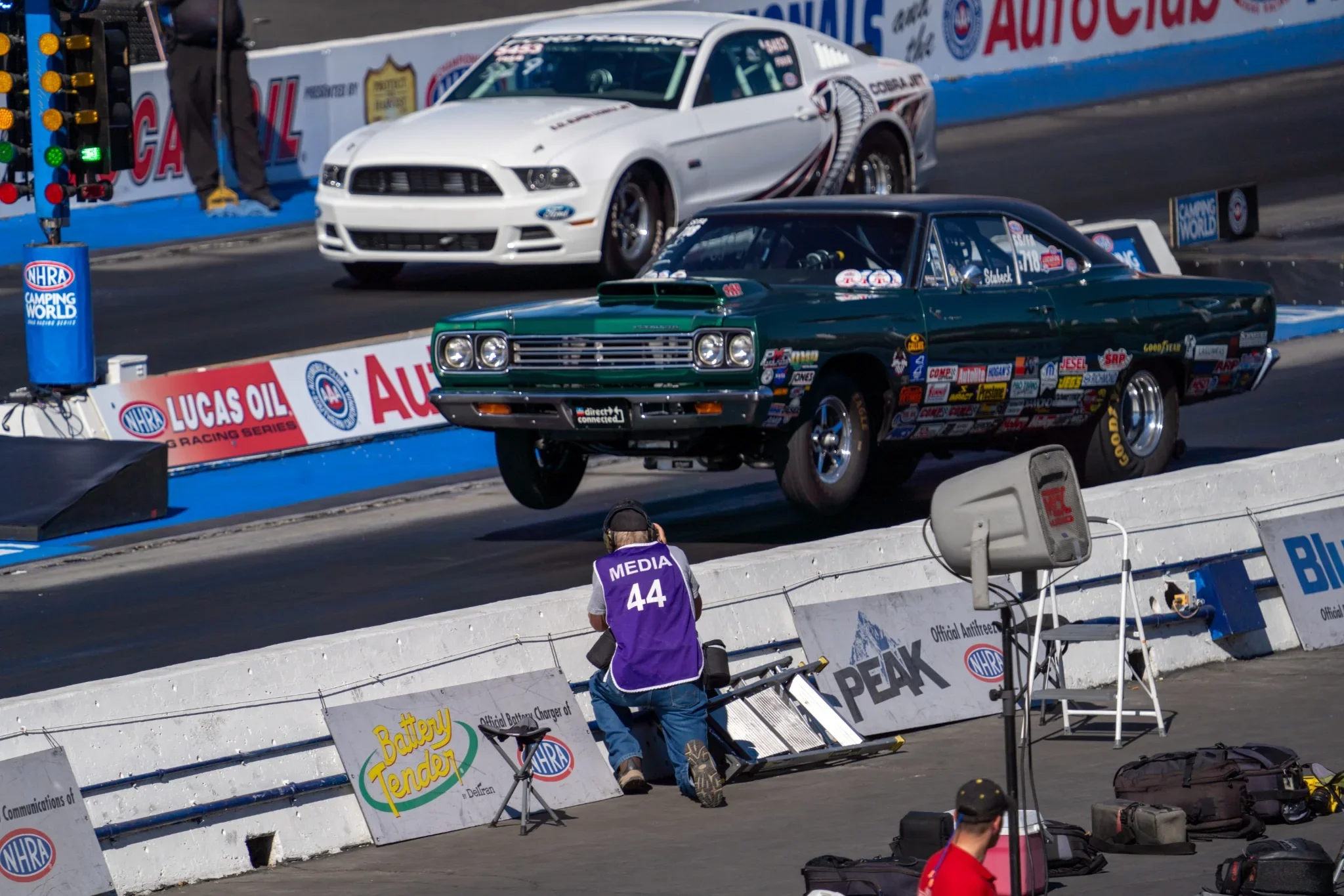 Two drag racing cars launch side by side. Photograph by Christopher Behymer.