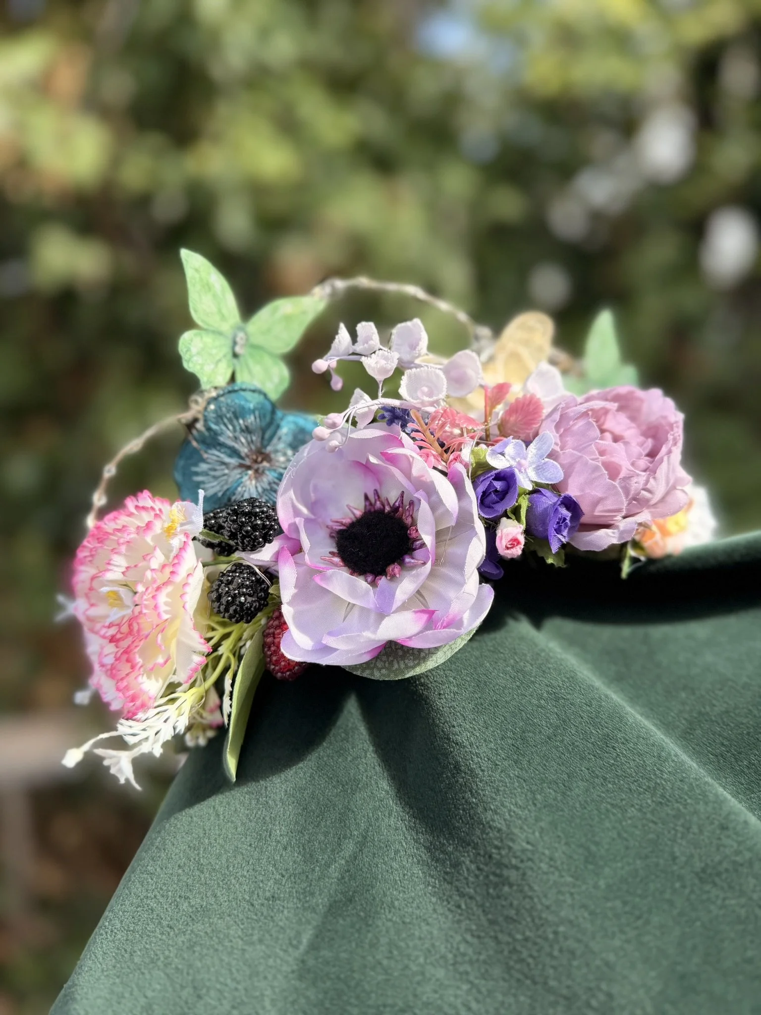 handmade flower fairy crown with flowers, butterflies, berries and lights