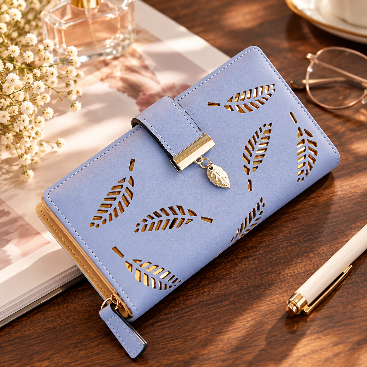 A purple multi-compartments wallet with a leaf cut-out design on a wooden desk.