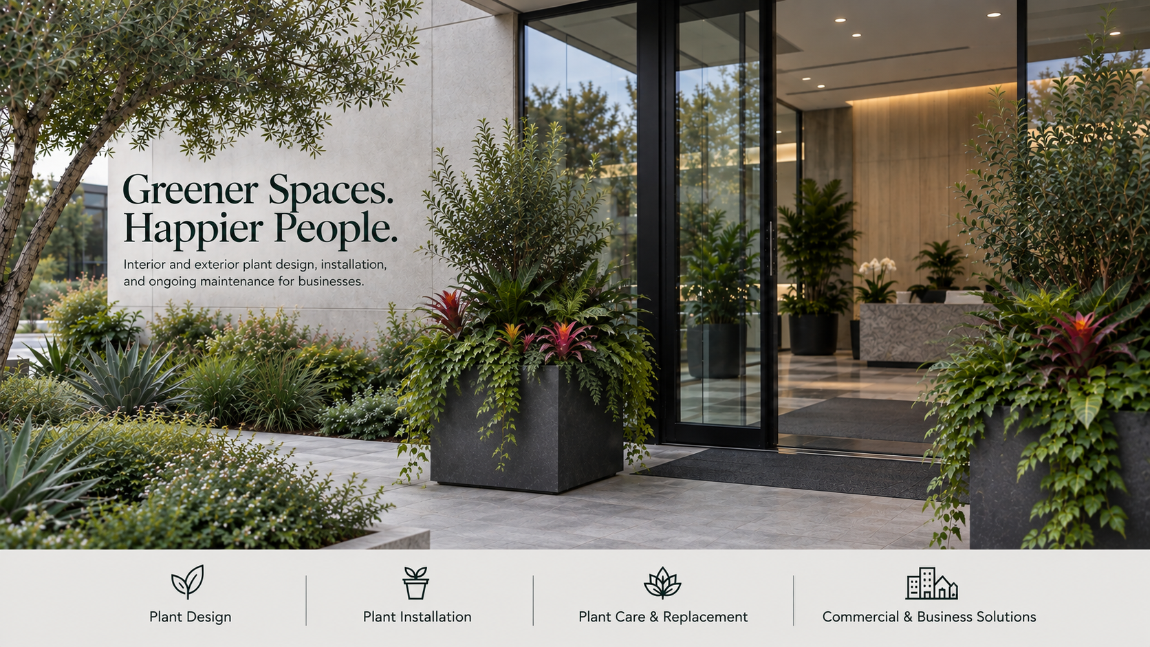 Entrance of a modern building with large glass doors, surrounded by lush green and colorful plants in black planters. The sign on the wall reads 'Greener Spaces. Happier People.' and describes interior and exterior plant design, installation, and maintenance services.