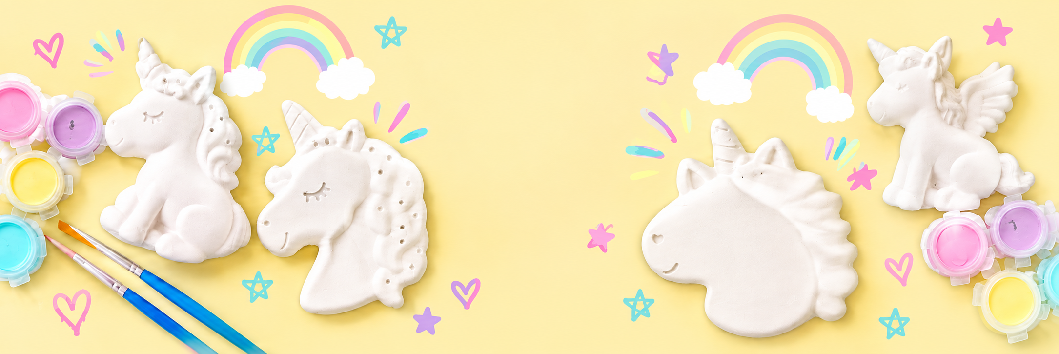 Unicorn-shaped white meringue cookies arranged on a pastel yellow background, surrounded by colorful paint palettes, paintbrushes, rainbow illustrations, stars, hearts, and clouds.