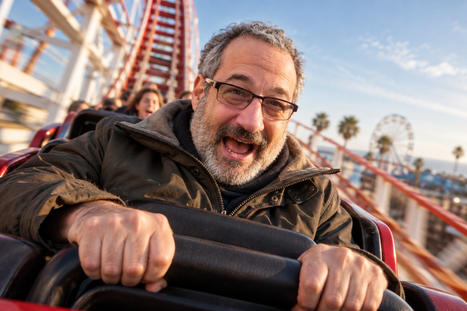 Josh Miller riding a roller coaster
