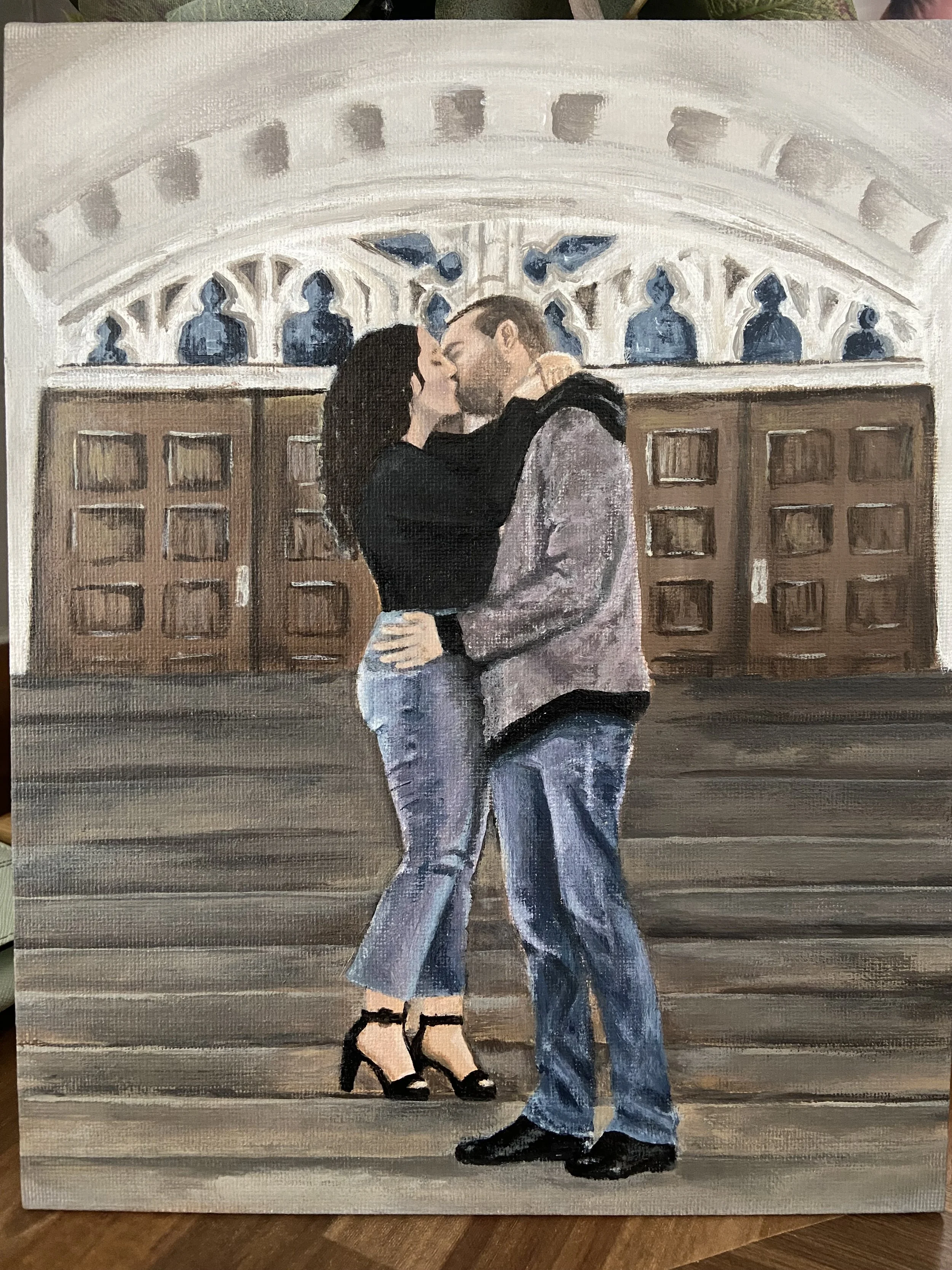 A painting of a couple sharing a kiss in front of a decorative wooden door and ornate archway.