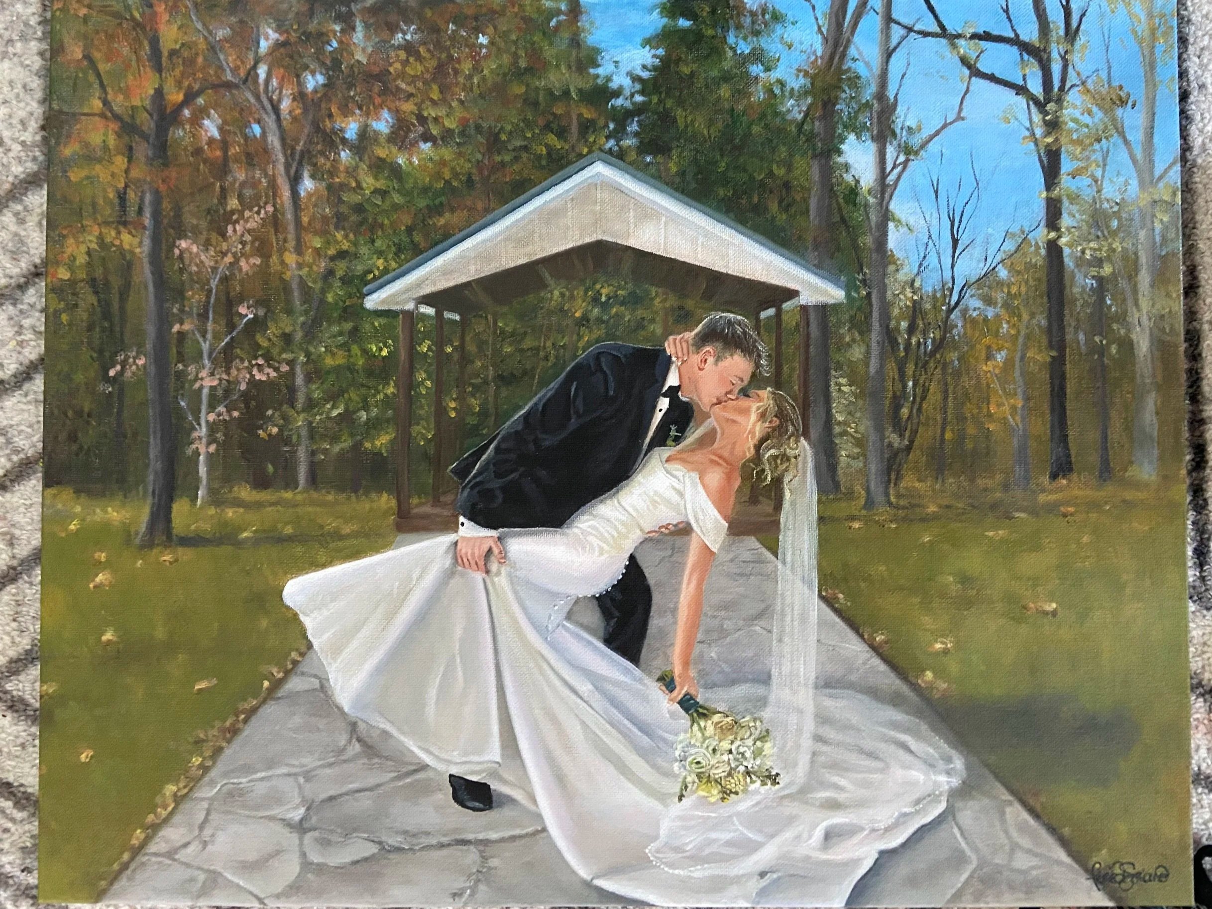 Painting of a wedding couple sharing a kiss outdoors in a park with autumnal trees, under a pavilion, with the bride in a white gown and the groom in a black tuxedo.