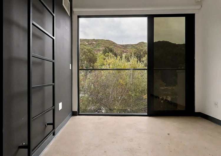 Laguna Beach loft photography: floor to ceiling glass onto the canyon